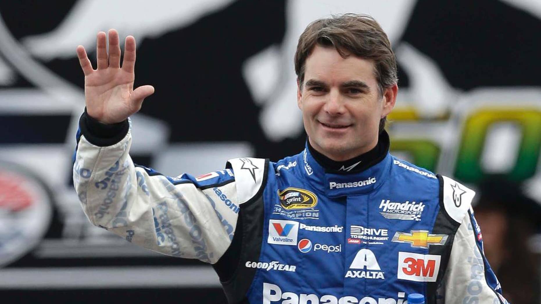 FILE - In this April 11, 2015, file photo, Sprint Cup Series driver Jeff Gordon waves during introductions before a NASCAR auto race at Texas Motor Speedway in Fort Worth, Texas. Jeff Gordon will drive the pace car for the Indianapolis 500 next month. He'll take the field to the green flag in the May 24 race, watch some laps with his wife and children, then fly to North Carolina to compete in NASCAR's Coca-Cola 600 that evening. Chevrolet made the announcement Wednesday, April 29, 2015, at Indianapolis Motor Speedway (AP Photo/Ralph Lauer, File)