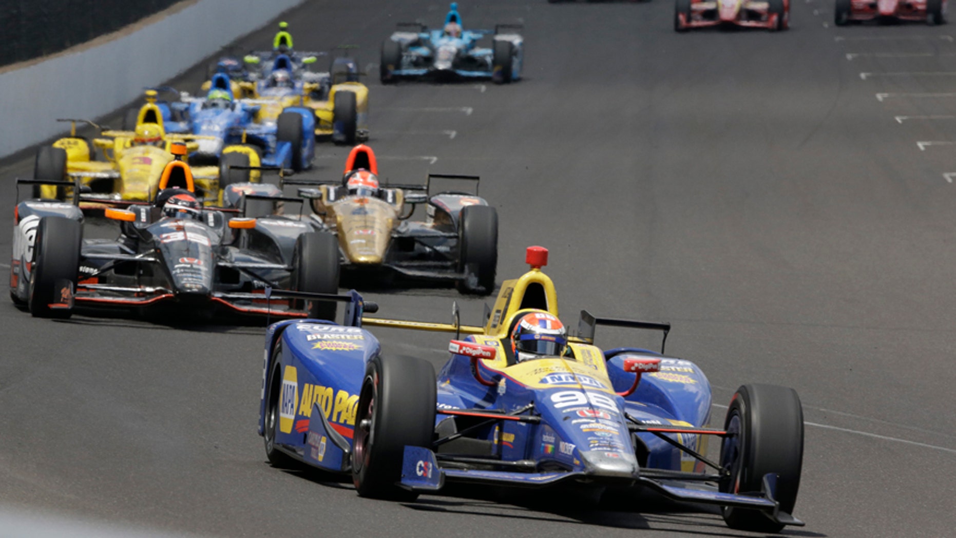 Alexander Rossi leads the field on his way to winning the 100th running of the Indianapolis 500 auto race at Indianapolis Motor Speedway in Indianapolis, Sunday, May 29, 2016. (AP Photo/R Brent Smith)