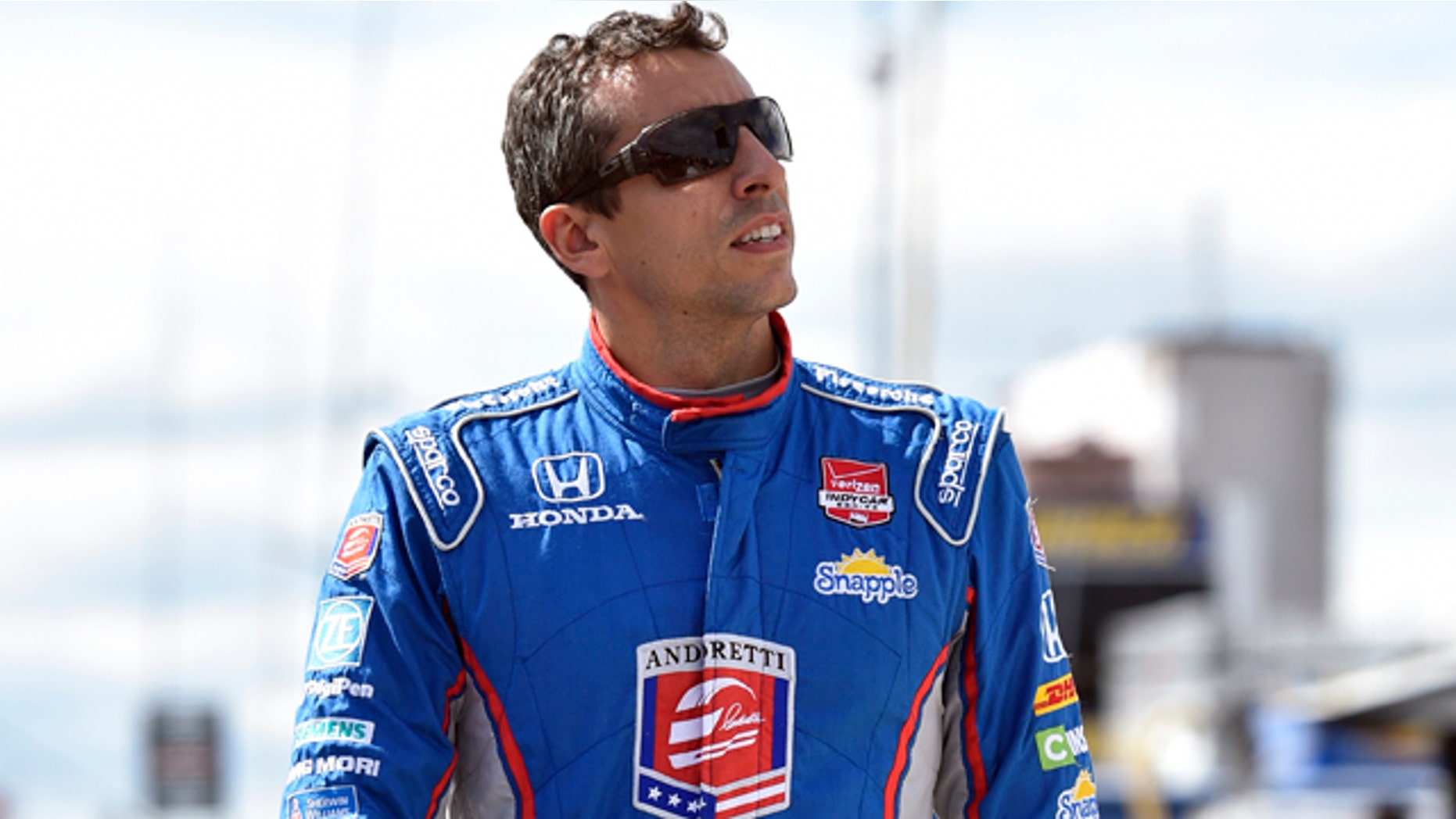 Aug. 22, 2015: Justin Wilson, of England, walks on pit road during qualifying for Sunday's Pocono IndyCar 500 auto race in Long Pond, Pa. Wilson was injured during Sunday's race and air lifted to the hospital. (AP Photo/Derik Hamilton)