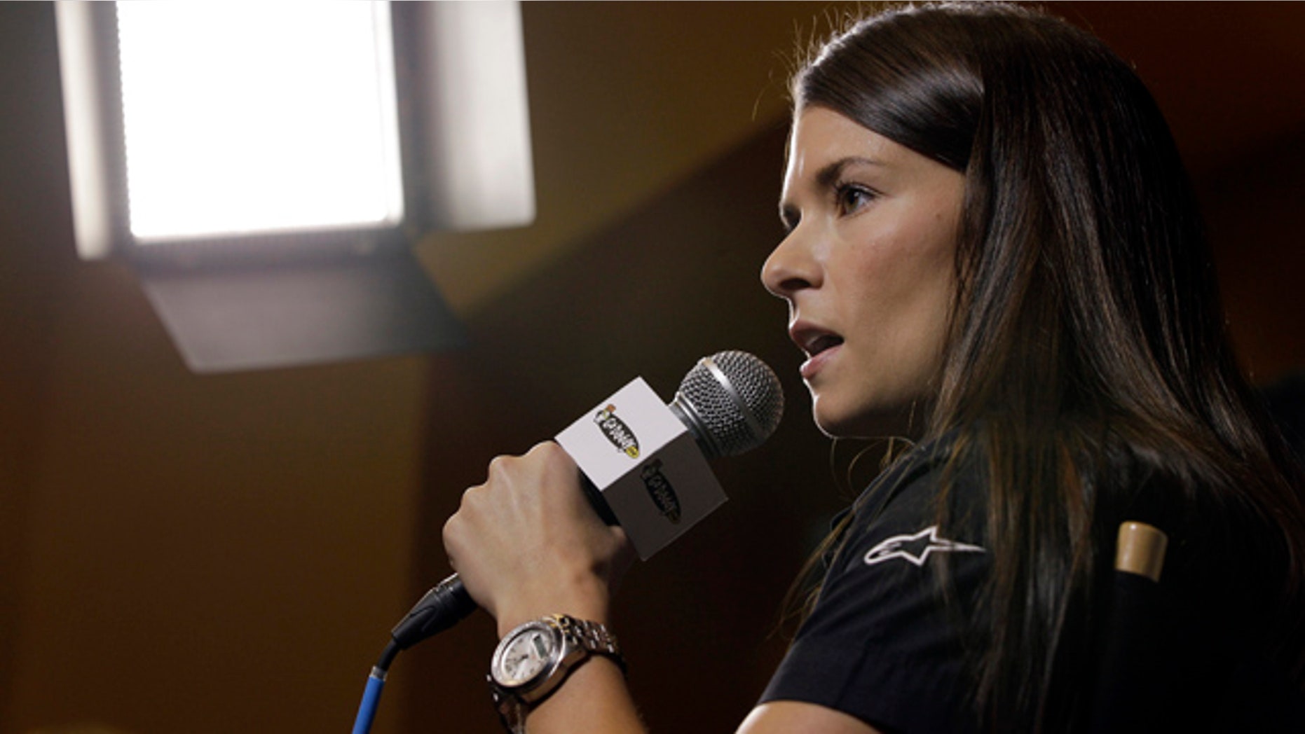 Danica Patrick answers a question at a news conference during the NASCAR Media Tour in Concord, N.C., Monday, Jan. 23, 2012. Patrick will not run in the Indianapolis 500 this season and instead will drive in the Coca-Cola 600, NASCAR's longest race of the year. (AP Photo/Chuck Burton)