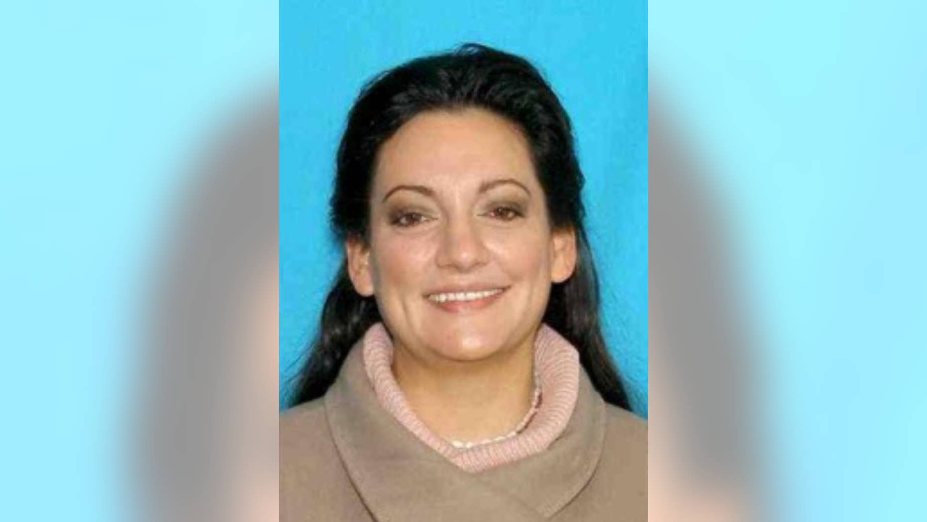 This image provided by Cannon Beach Wash. Police Department shows an undated photo of Jessica Smith, 40. A hotel housekeeper discovered an injured 13-year-old girl and the body of her 2-year-old sister at an inn on the Oregon Coast on Friday,Aug. 1, 2014 and police were searching for their mother. Cannon Beach Police Chief Jason Schermerhorn said Smith, 40, of Goldendale, Washington, is a person of interest in the case. (AP Photo/Cannon Beach Police Department)