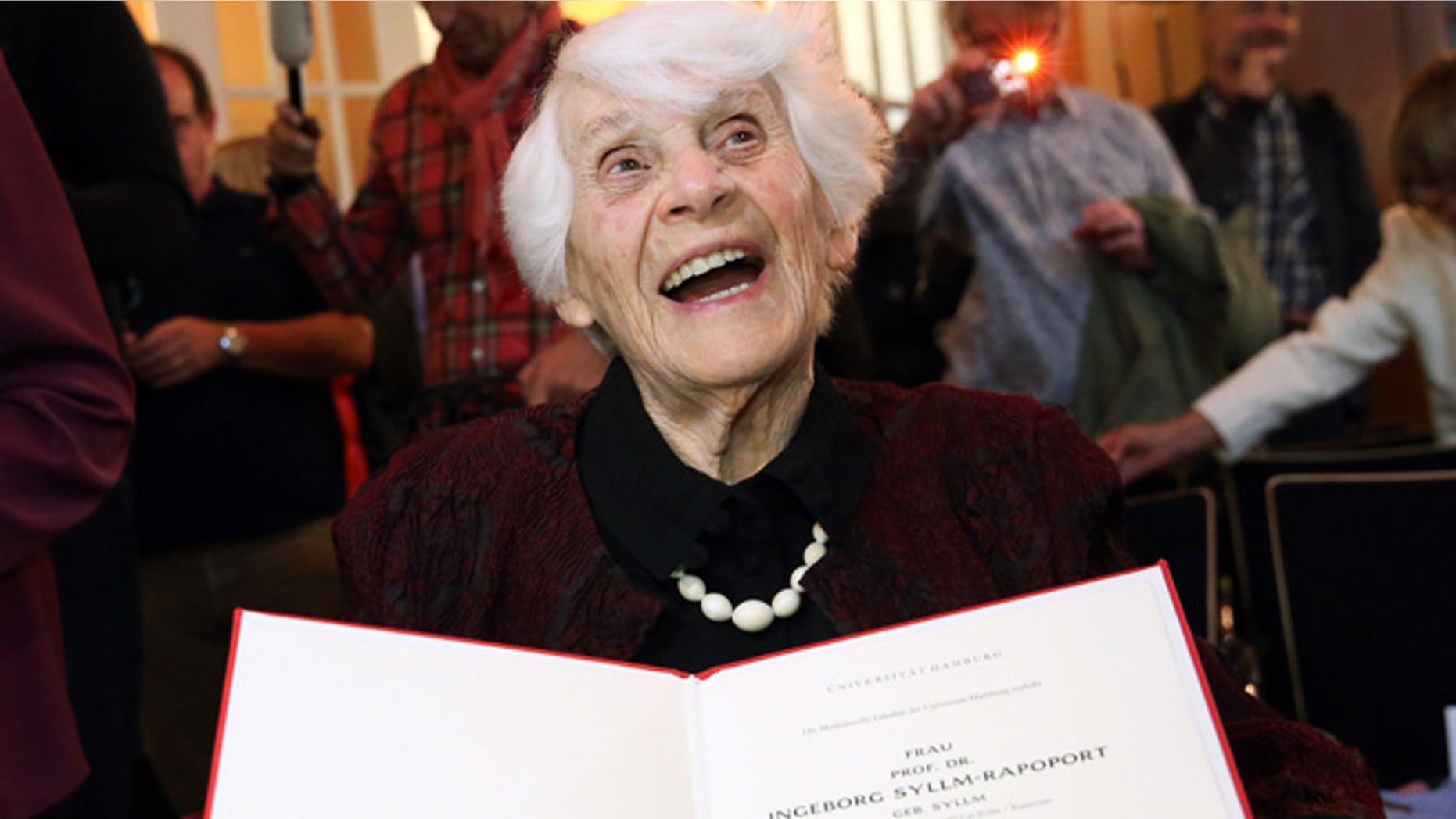 June 9, 2015: Ingeborg Syllm-Rapoport holds up her doctoral certificate during a ceremony at the University Clinic Hamburg-Eppendorf in Hamburg, Germany.