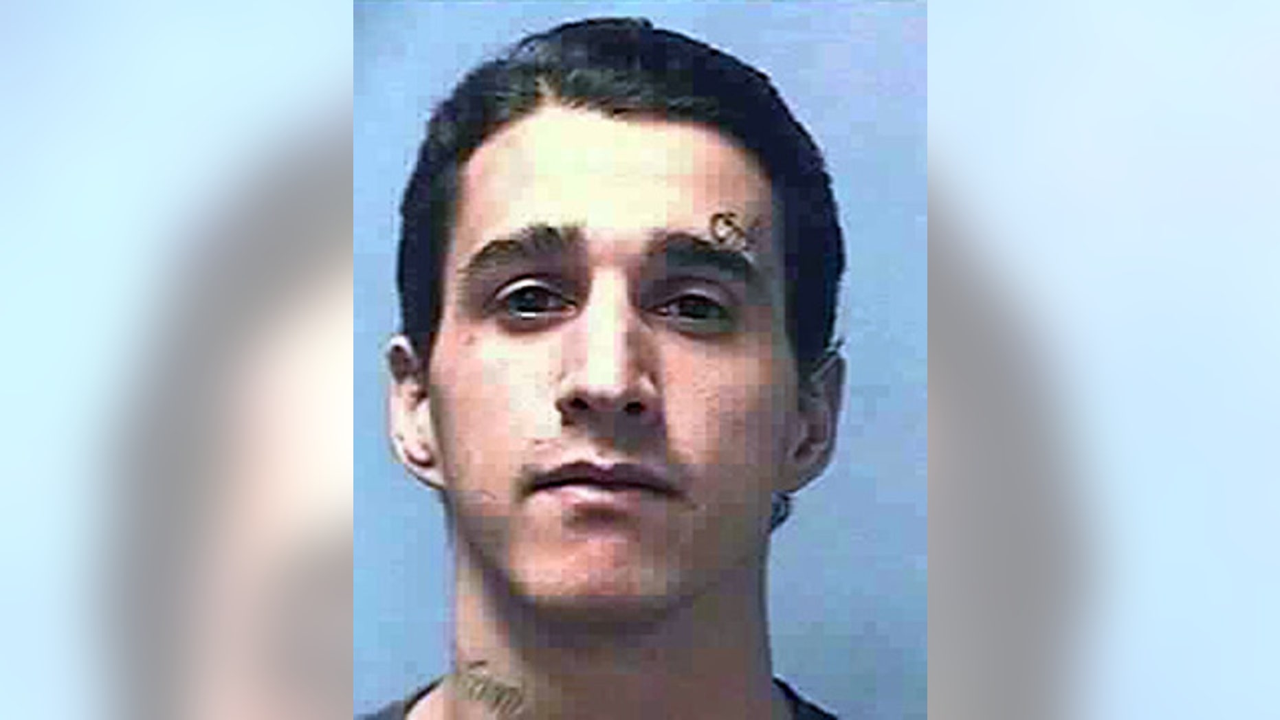 This undated photo provided by the Nevada Department of Corrections shows Carlos Manuel Perez Jr., 28. The Clark County Coroner in Las Vegas said Wednesday, March 25, 2015, that Perez's death on Nov. 12, 2014, of multiple gunshots to the head, neck, chest and arms at High Desert State Prison was a homicide. (AP Photo/Nevada Department of Corrections)