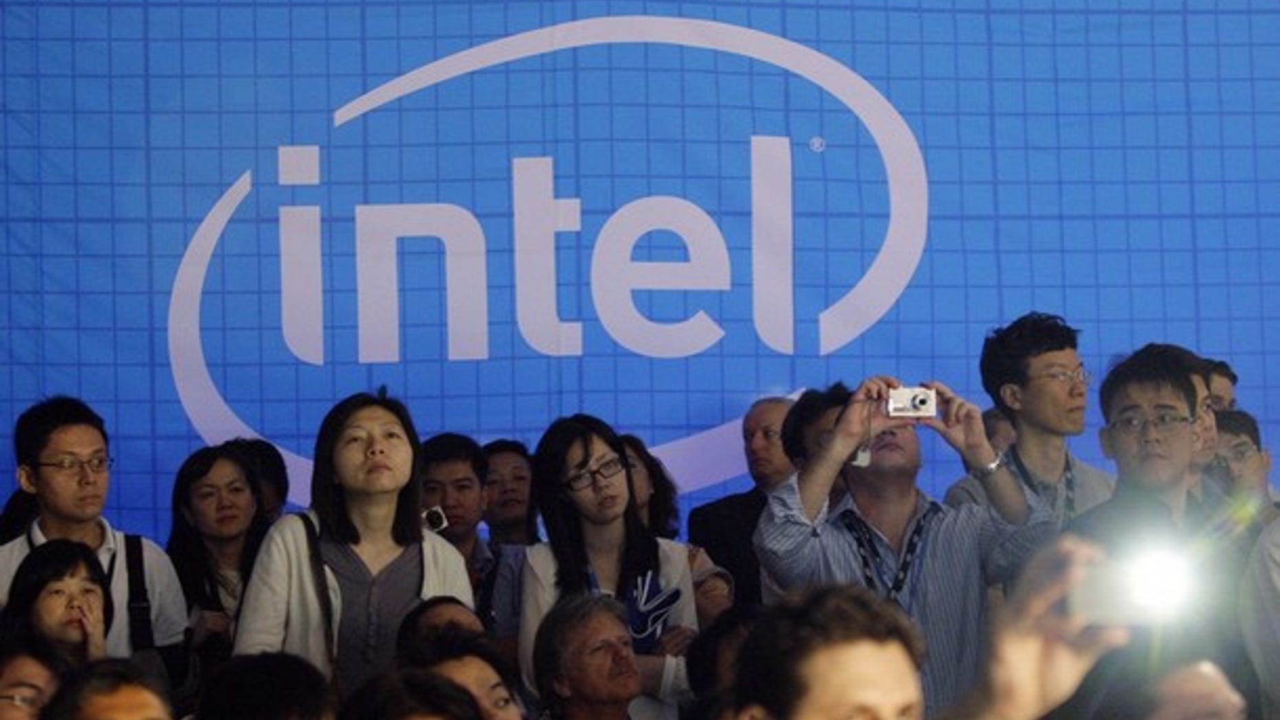 People take pictures in the Intel booth at the Computex 2010 computer fair in Taipei June 1, 2010.