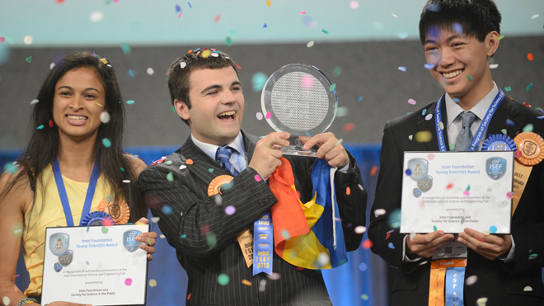 May 17, 2013: Top winner Ionut Budisteanu, 19, of Romania (center) with second-place winners Eesha Khare, 18, of Saratoga, Calif. (left) and Henry Lin, 17, of Shreveport, La. celebrate their awards at the Intel International Science and Engineering Fair, the world's largest high school science research competition. More than 1,600 high schoolers from 70 countries, regions and territories competed for more than $4 million in awards this week.