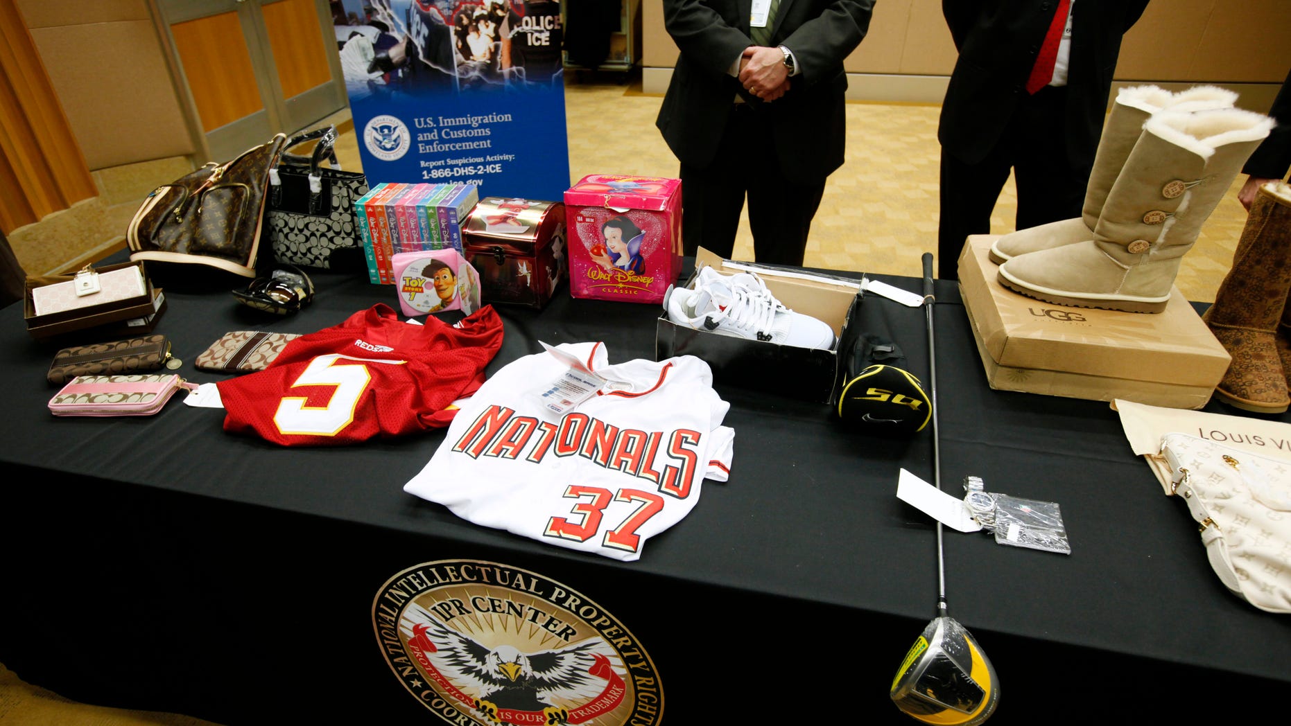 Nov. 29: Various counterfeit products, including Ugg brand boots, Washington Nationals baseball and Washington Redskins team football jerseys, and designer bags are displayed on a table at the Justice Department in Washington, D.C., during a news conference with Attorney General Eric Holder.