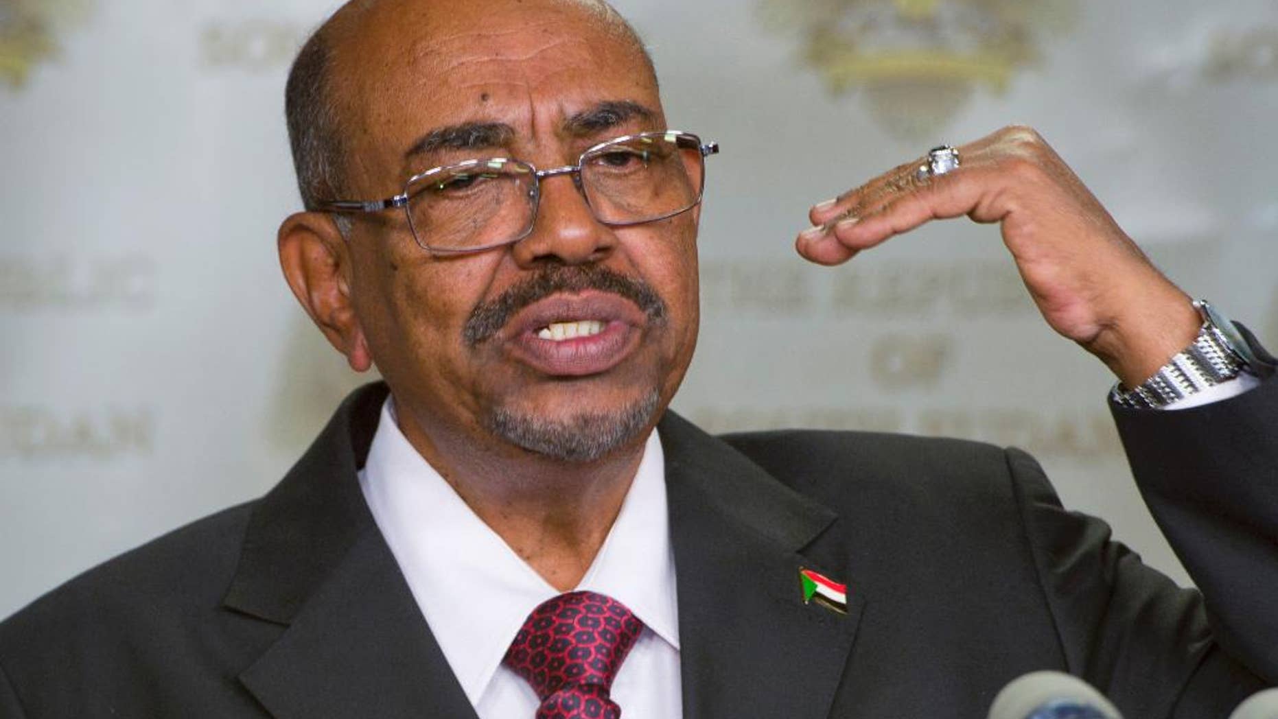 FILE - In this Jan. 6, 2014 Sudan's president Omar al-Bashir speaks after meeting with South Sudan's President Salva Kiir, in the capital Juba, South Sudan. Judges at the International Criminal Court on Monday March 9, 2015 have called on the U.N. Security Council to "take the necessary measures" to tackle Sudan's persistent refusal to arrest the country's president and send him to The Hague to stand trial on charges of orchestrating genocide in Darfur. It was the Security Council that called on the Hague-based court in 2005 to investigate widespread atrocities in Darfur — a move that led to President Omar al-Bashir being charged with genocide. (AP Photo/Ali Ngethi, File)