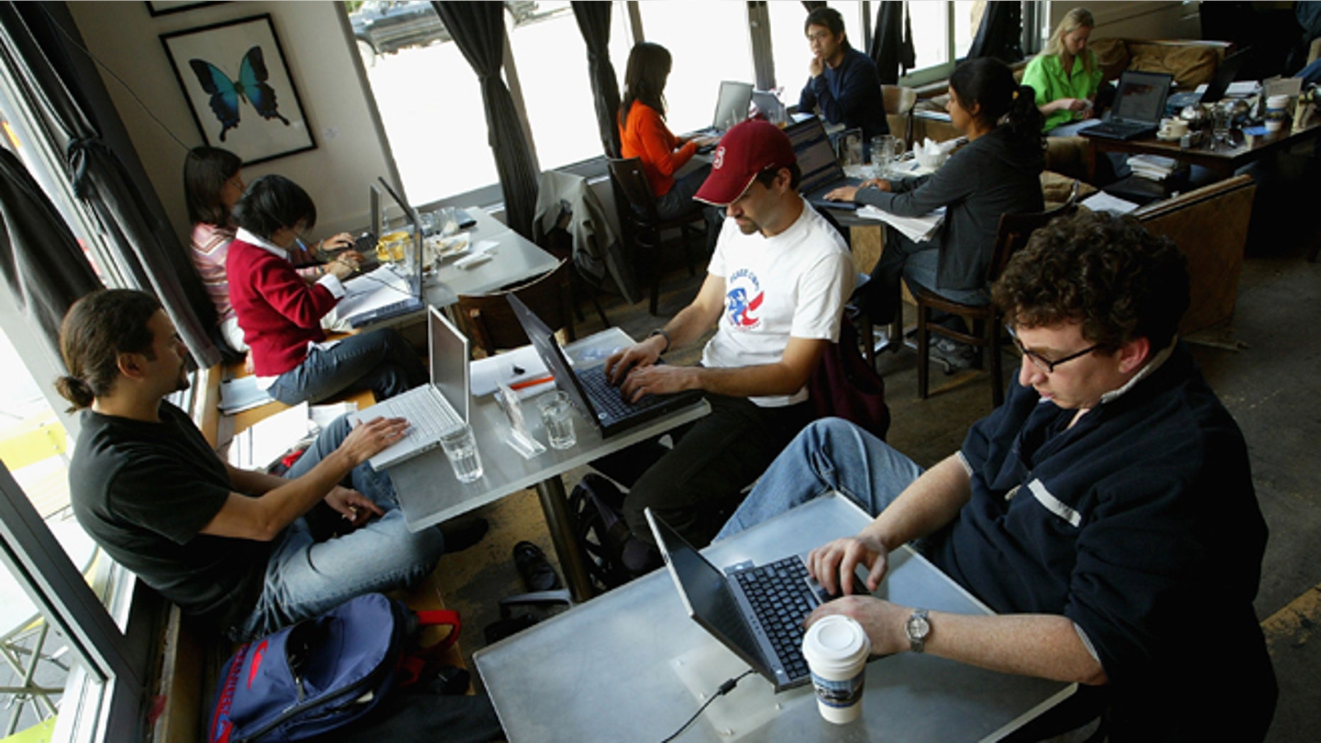 SAN FRANCISCO, CA - APRIL 9: Customers at the Canvas Cafe take advantage of free wireless "wi-fi" internet access April 9, 2004 in San Francisco. According to a new study sponsored by Intel Corp., the San Francisco Bay area is the nation's top market for wireless Internet hot spots followed by Orange County, Calif., Washington, D.C., and Austin, Texas. (Photo by Justin Sullivan/Getty Images)