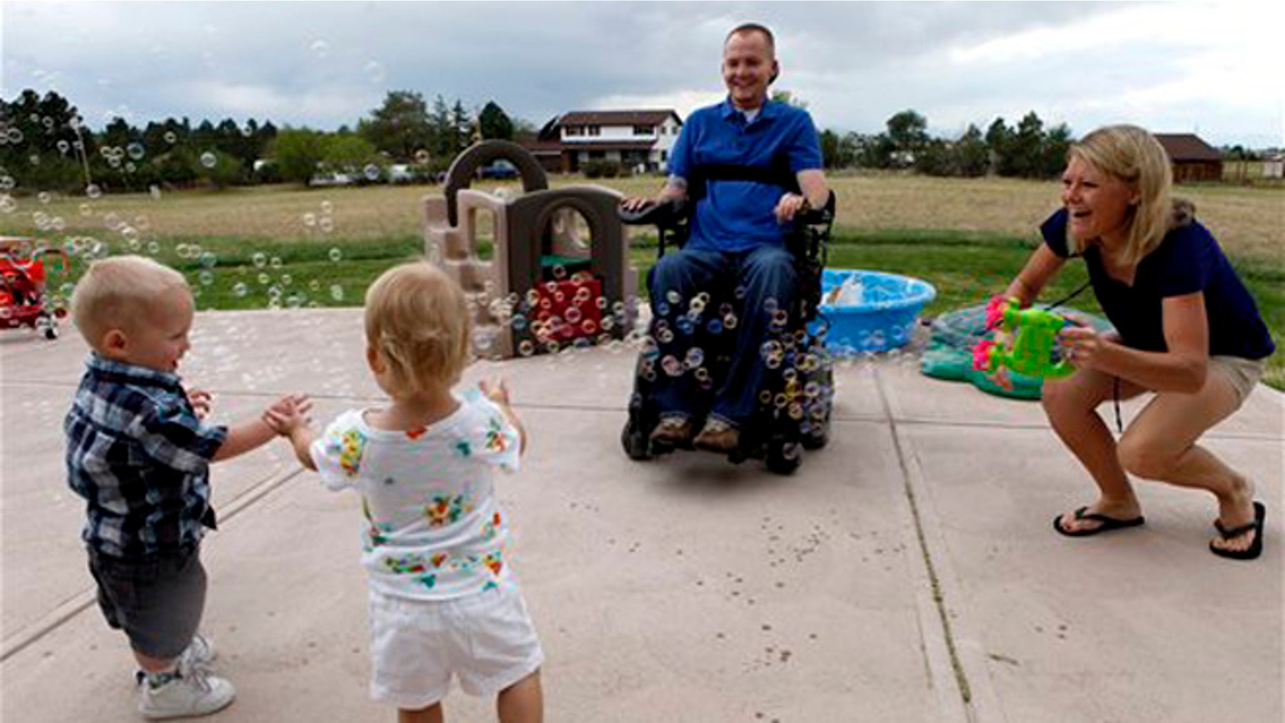 FILE: Aug. 2, 2012: This photo shows the Keil family playing at their home near Parker, Colo. From left are; Matthew Jr., Faith, Matthew and Tracy.