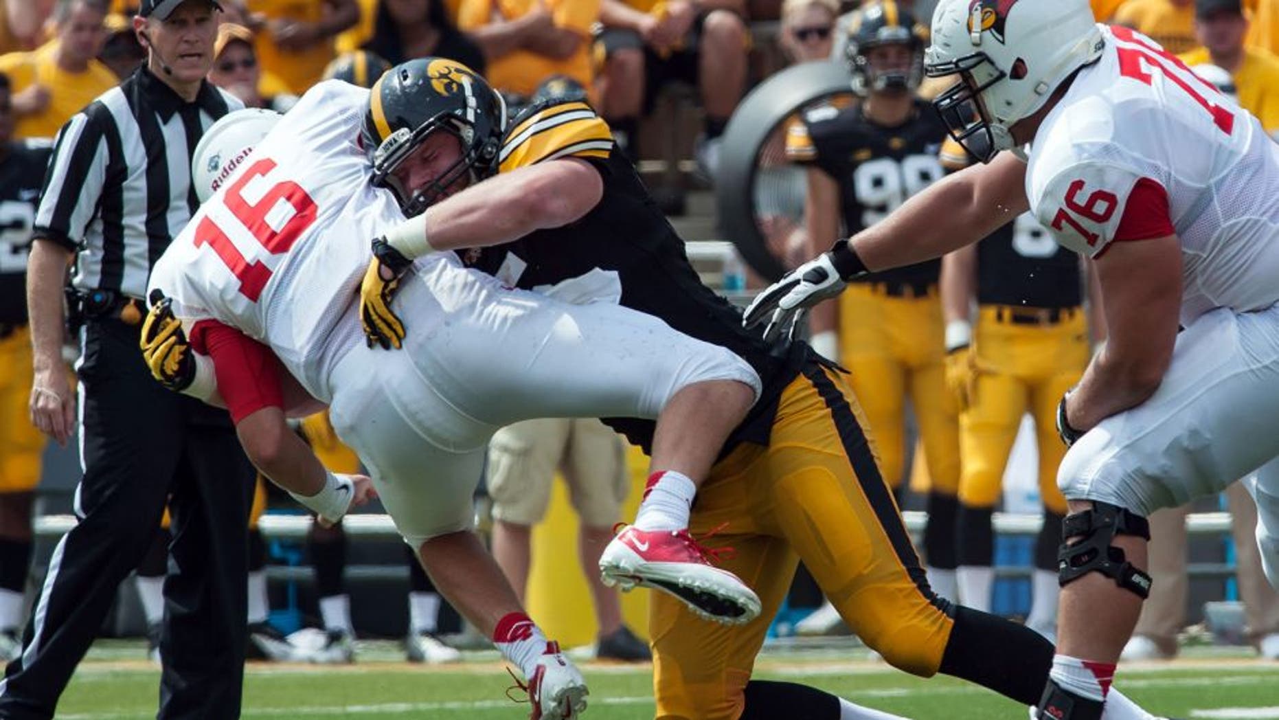 Sep 5, 2015; Iowa City, IA, USA; Iowa City, IA, USA; Iowa Hawkeyes defensive lineman Drew Ott (95) tackles Illinois State Redbirds quarterback Jake Kolbe (16) during the fourth quarter at Kinnick Stadium. Iowa won 31-14. Mandatory Credit: Jeffrey Becker-USA TODAY Sports