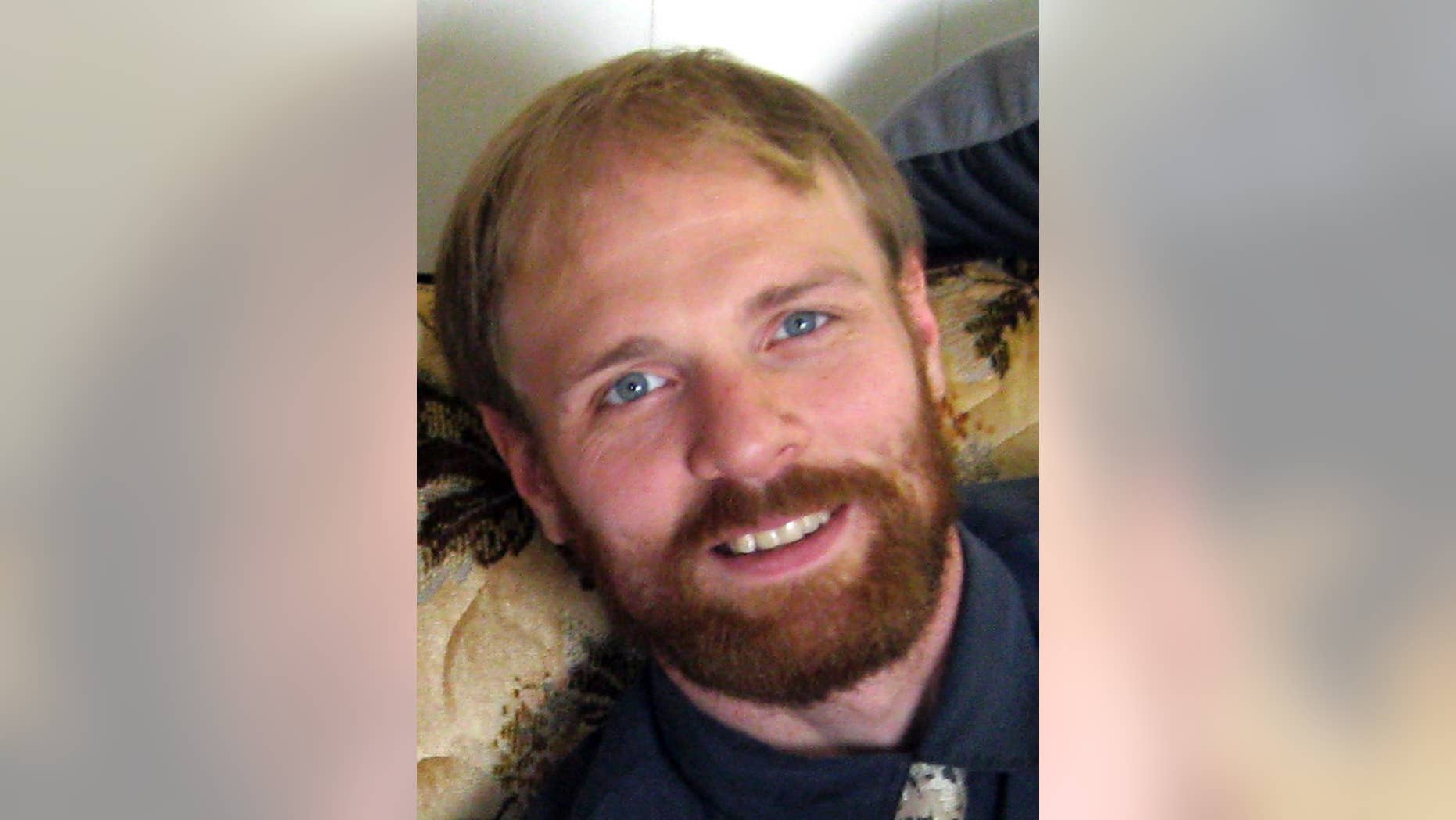 In this 2014 photo provided by Gary Lentzkow is his son Matthew Lentzkow in La Porte City, Iowa. Lentzkow, 36, of Newton, died on Nov. 1 in a traffic accident on Interstate 80 after managing to escape from an Iowa State Patrol car while handcuffed. (AP Photo/Gary Lentzkow)