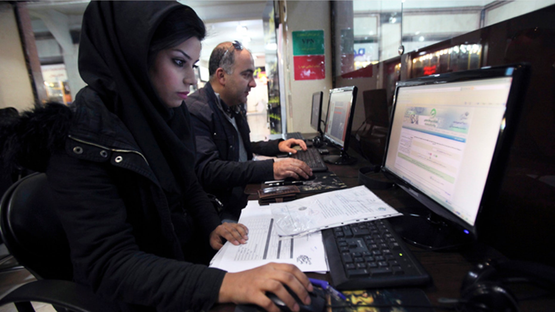Jan. 6, 2013: Iranians surf the web in an internet cafe at a shopping center, in central Tehran, Iran. Iran's police chief says the Islamic Republic is developing new software to control social networking sites.