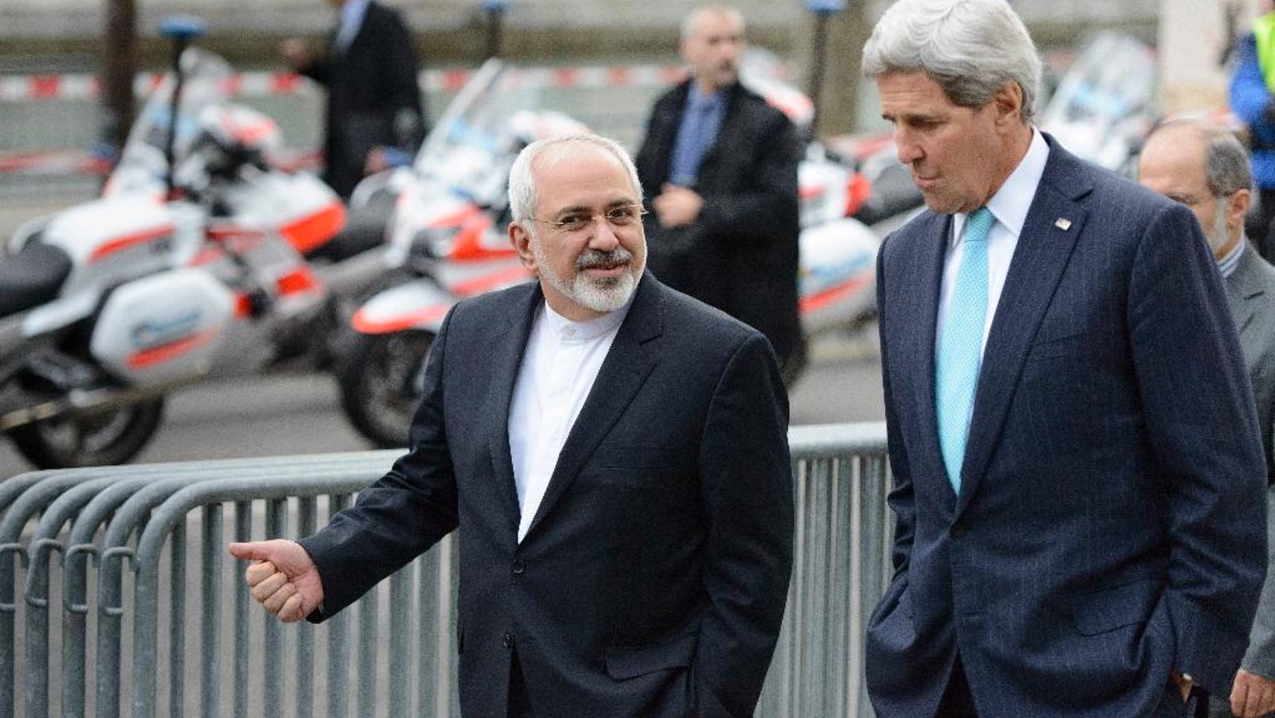 FILE - In this file photo taken Wednesday, Jan. 14, 2015, U.S. Secretary of State John Kerry, right, speaks with Iranian Foreign Minister Mohammad Javad Zarif, as they walk in Geneva, Switzerland, ahead of the next round of nuclear discussions. Should the talks over Iran's nuclear program collapse, the alternatives are not appealing: the war option that the United States has kept on the table has few fans, and the world does not seem willing to truly bring Iran to its knees by shutting off the flow of capital and goods. (Laurent Gillieron/Keystone via AP, File)