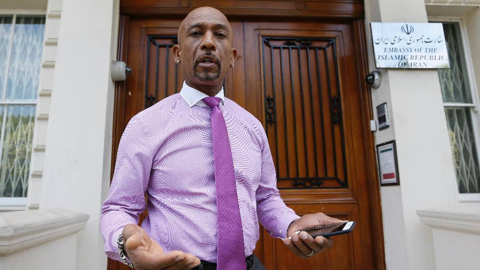 FILE - In a Friday, June 26, 2015 file photo, American television personality Montel Williams speaks to media outside the Iranian Embassy in London. Williams went to the embassy to request a meeting with the Iranian Chief of Mission. Williams is campaigning for the release of Amir Hekmati, an American who is being held in Iran’s Evin Prison. (AP Photo/Kirsty Wigglesworth, File)