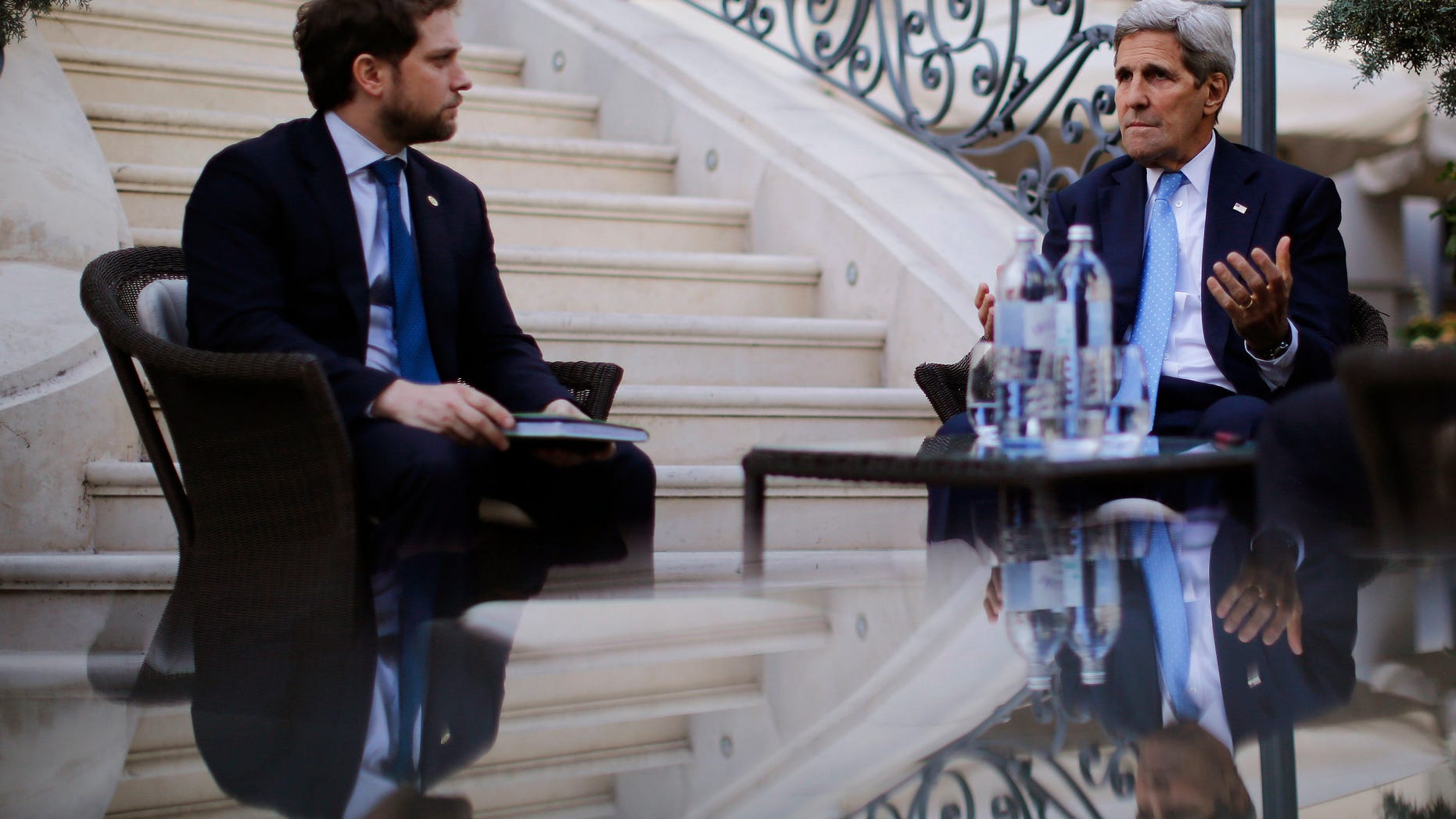 July 10, 2015 - U.S. Secretary of State John Kerry, right, and State Department Chief of Staff Jon Finer, left, meet with members of the U.S. delegation at Palais Coburg hotel where the Iran nuclear talks meetings are being held in Vienna, Austria. Iranian Foreign Minister Mohammad Javad Zarif accused major powers Friday of backtracking on previous pledges and throwing up new "lines" at nuclear talks.