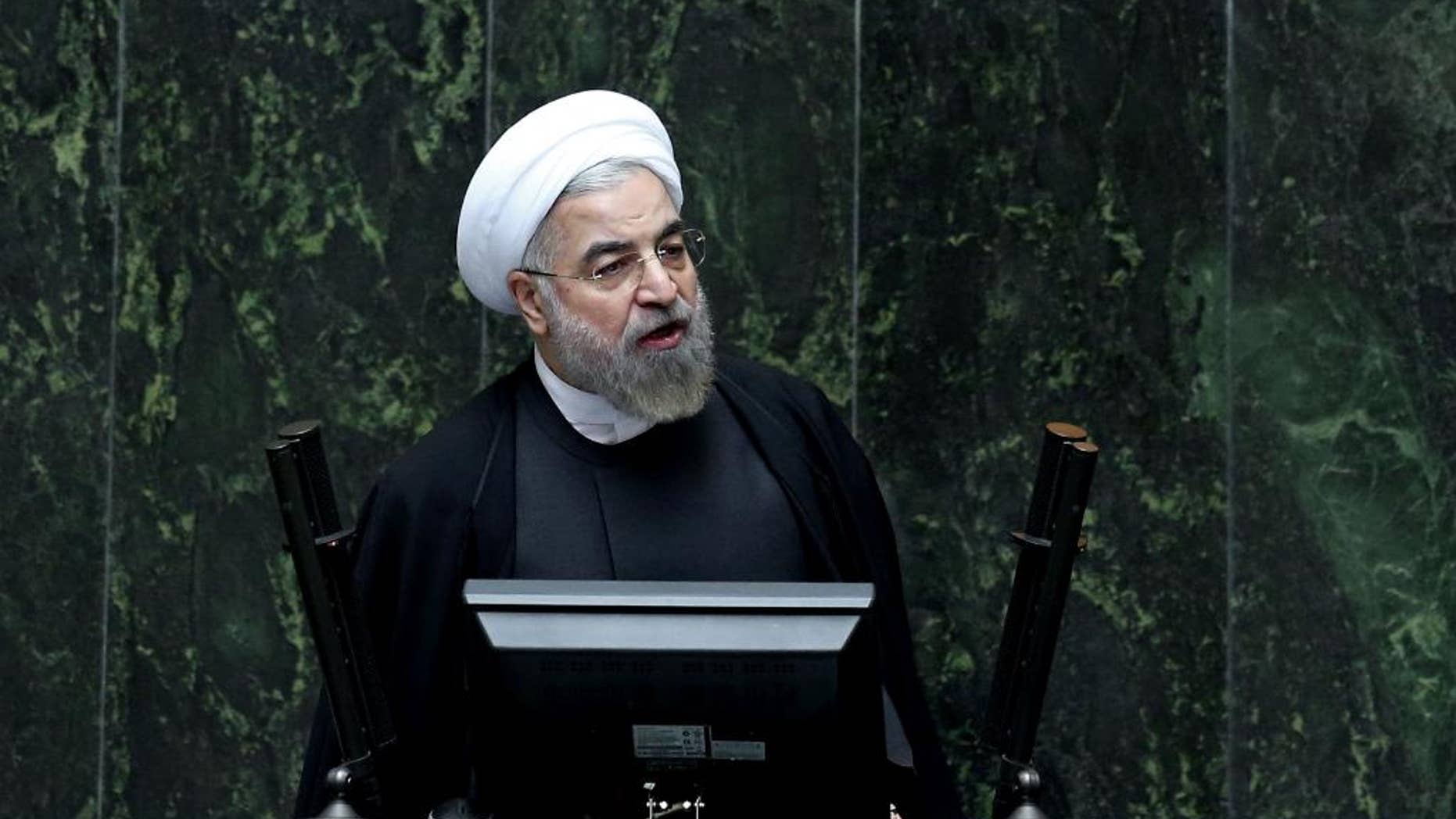 FILE - In this file photo taken Wednesday, Oct. 29, 2014, Iranian President Hassan Rouhani speaks during a debate on a vote of confidence for his choice for the new minister of Science, Research and Technology, Mahmoud Nili Ahmadabadi, in an open session of parliament in Tehran, Iran. The political stakes are high for Rouhani as nuclear negotiations with the West enter the homestretch toward a June deadline. Reaching a deal would bring him a victory, help repair the economy and boost moderates seeking greater social freedoms. Failure will strengthen hard-liners who opposed the talks from the start. (AP Photo/Ebrahim Noroozi, File)