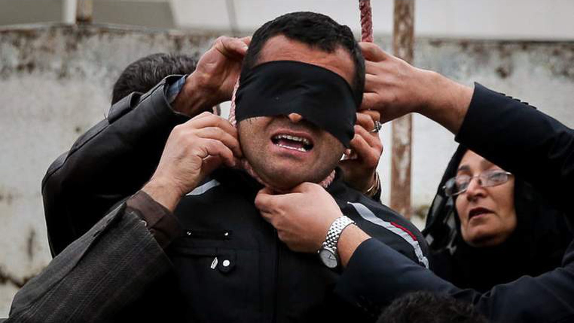 The victim's parents remove the noose.