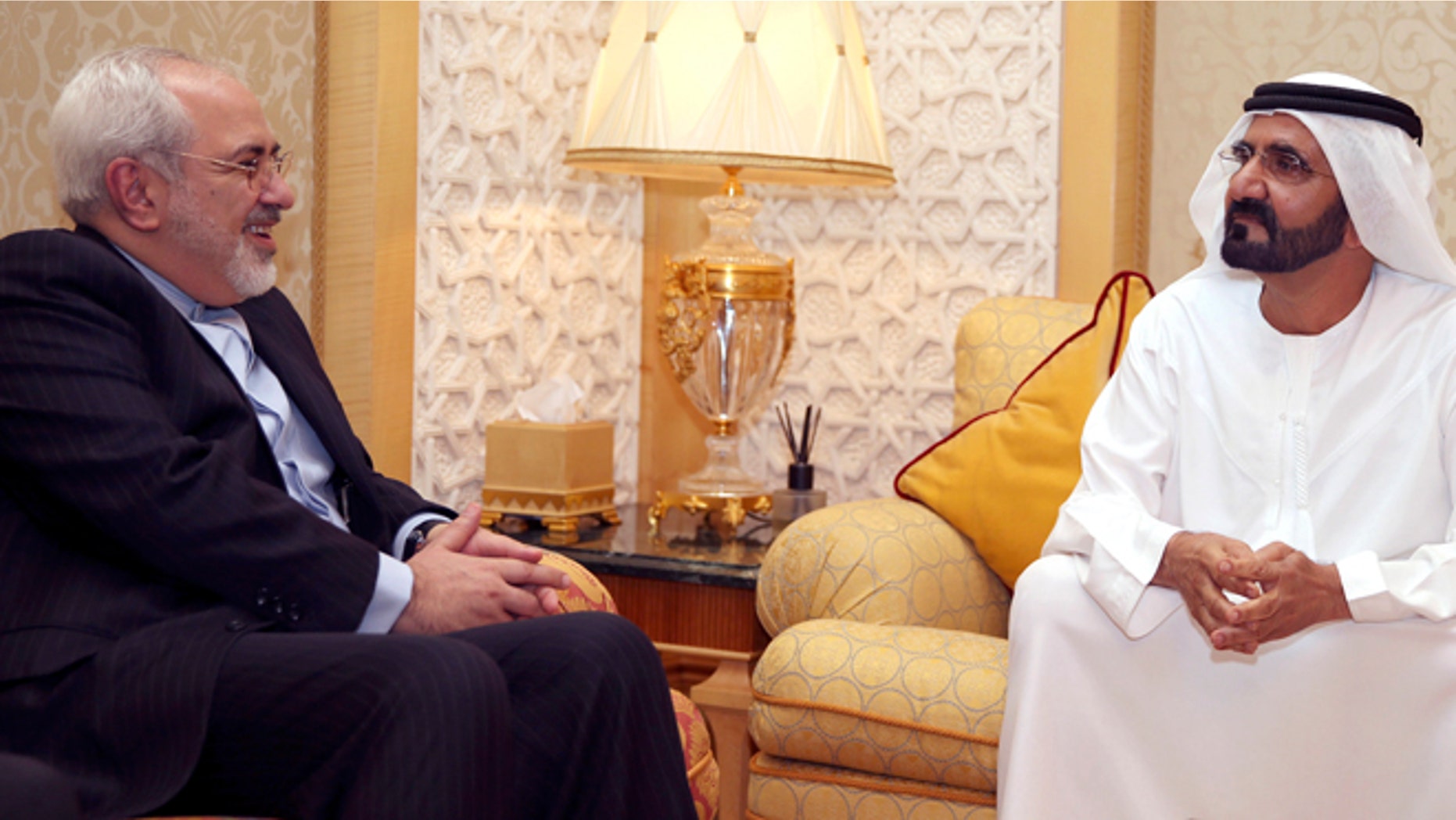 April 15, 2014: In this image released by the Emirates News Agency, WAM, Iranian Foreign Minister Mohamad Javad Zarif, left, meets with Sheikh Mohammed bin Rashid Al Maktoum, UAE Prime Minister and ruler of Dubai to discuss bilateral relations and regional developments, in Dubai, United Arab Emirates.