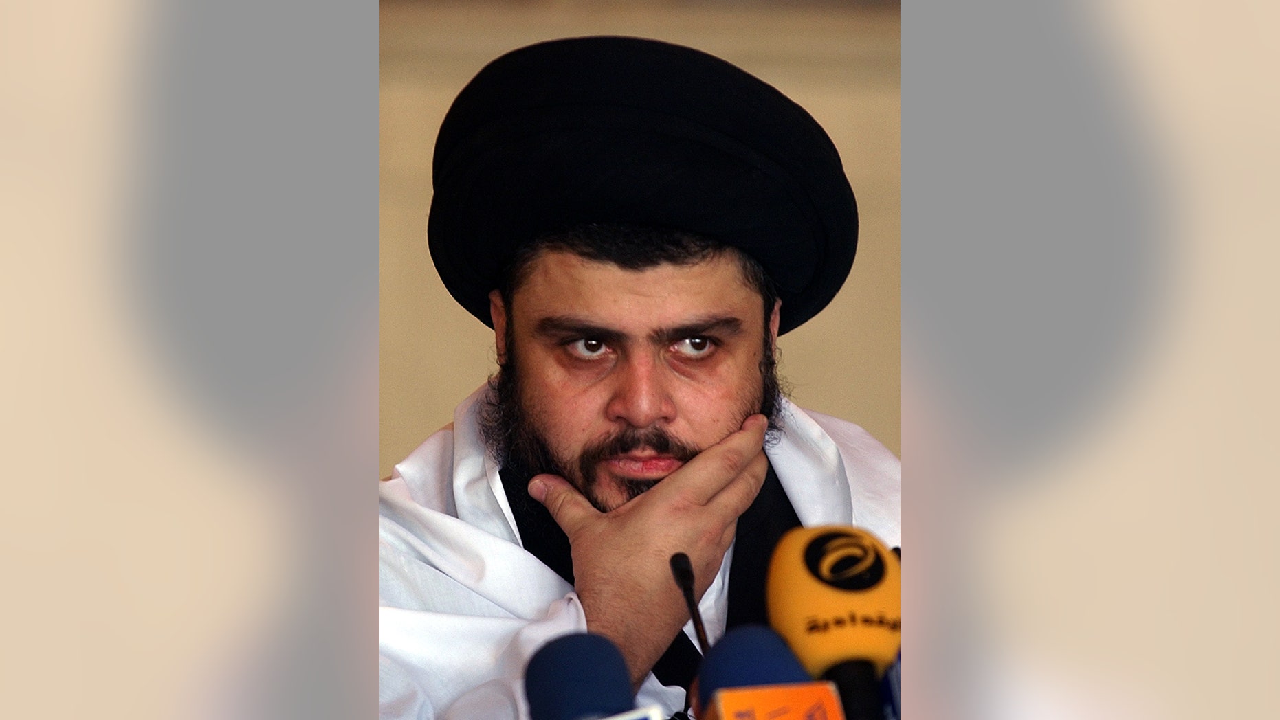 Sep. 22, 2006: In this file photo, Radical Shiite cleric Muqtada al-Sadr delivers a Friday sermon, in a Mosque, in Kufa, Iraq. Iraqi officials said al-Sadr returned to Iraq after a nearly 3-year absence.