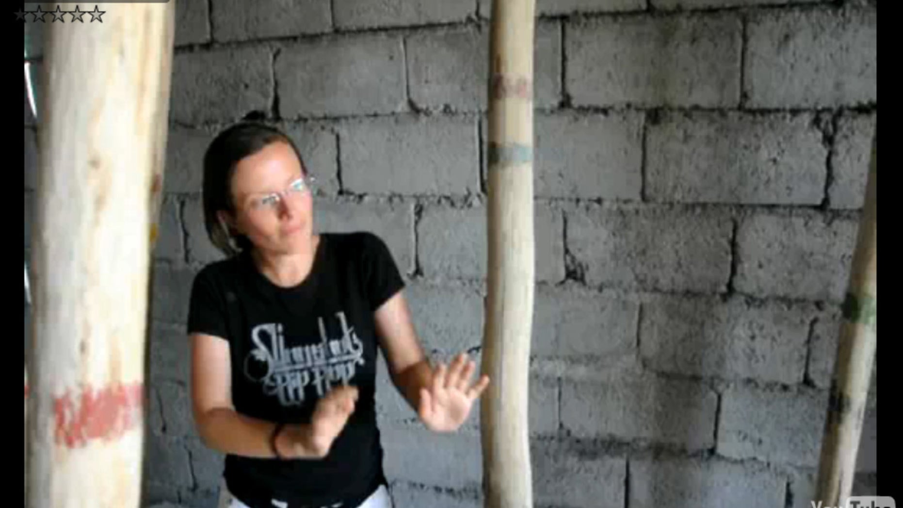 This image made from a July 29, 2009 video released Tuesday, Oct. 27, 2009 by Shon Meckfessel and the families of Shane Bauer, Sarah Shourd and Josh Fattal, shows Shourd dancing in an unfinished cinder block building in the Kurdish city of Irbil, Iraq. The families of three Americans being held in Iran released video footage Tuesday that they say proves the three were simply on vacation and had no underhand intentions when they strayed across the border. (AP Photo/Shon Meckfessel) NO SALES