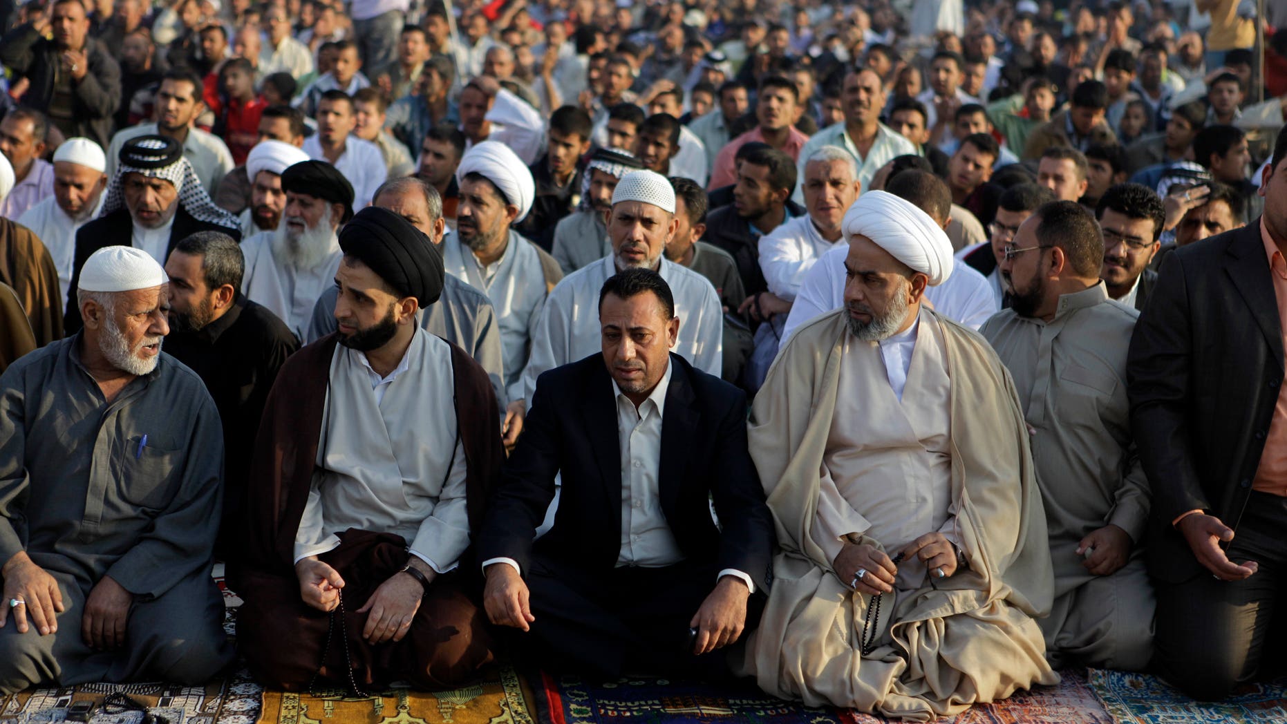 File photo showing followers of radical Shiite cleric Muqtada al-Sadr crowding a street as they attend open air Friday prayers in Sadr City, Baghdad.