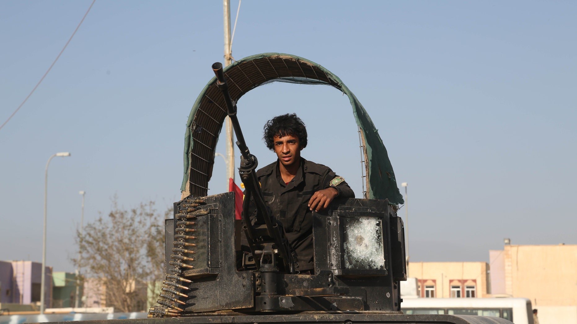 March 15, 2015 - A young volunteer militiaman on his way to the battlefield against Islamic State fighters in Tikrit, 80 miles north of Baghdad, Iraq. Kurdish forces in Iraq are investigating 2 other possible ISIS chemical weapons attacks, a top official said Monday, as authorities put an Iraqi offensive to retake Saddam Hussein's hometown on hold.