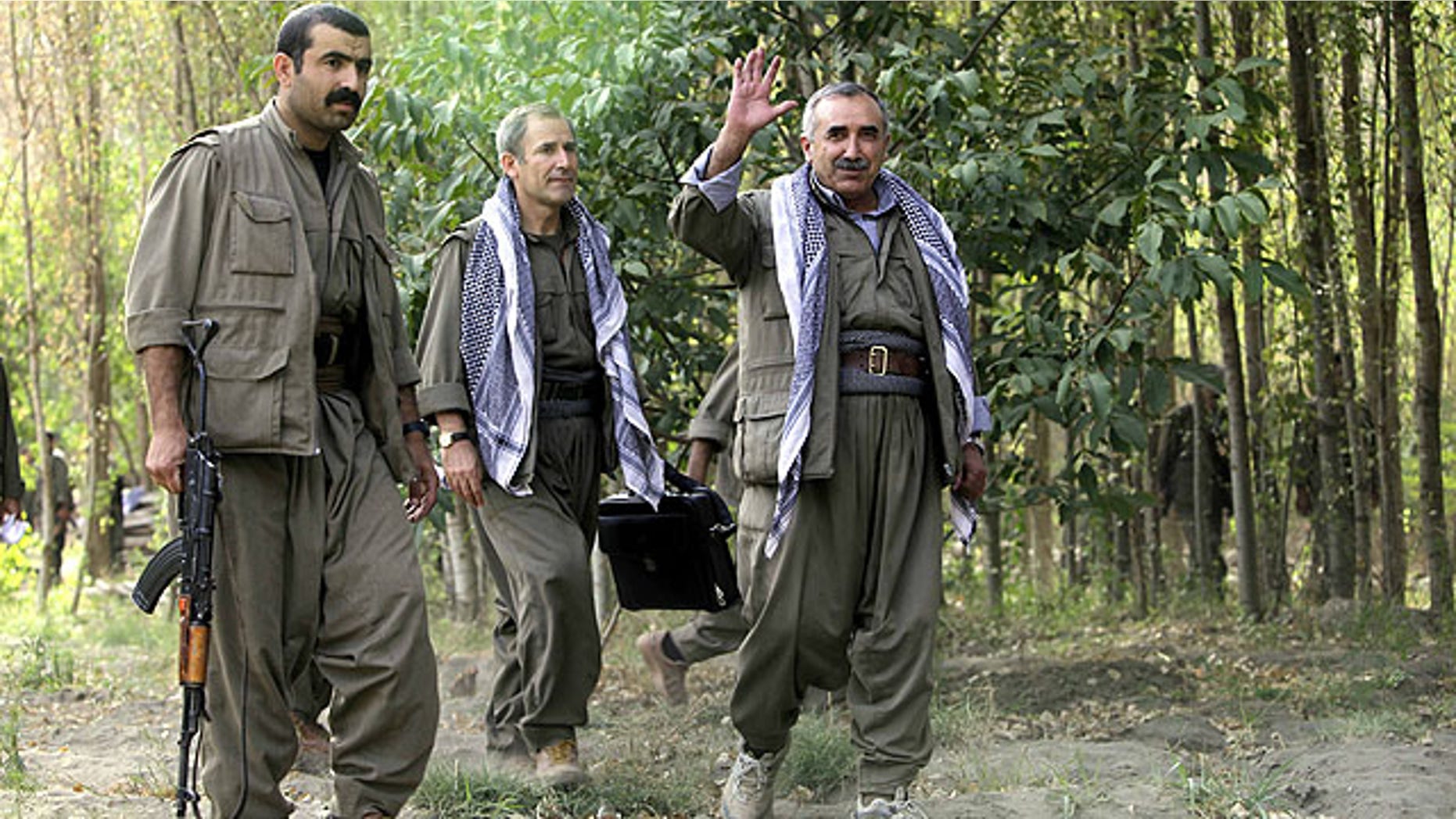 Sept. 30, 2010: Murad Karialan, right, and Bouzan Teken, center, of the Kurdistan Workers' Party, or PKK, speaks to the press in the Qandil mountain range, northern Iraq.