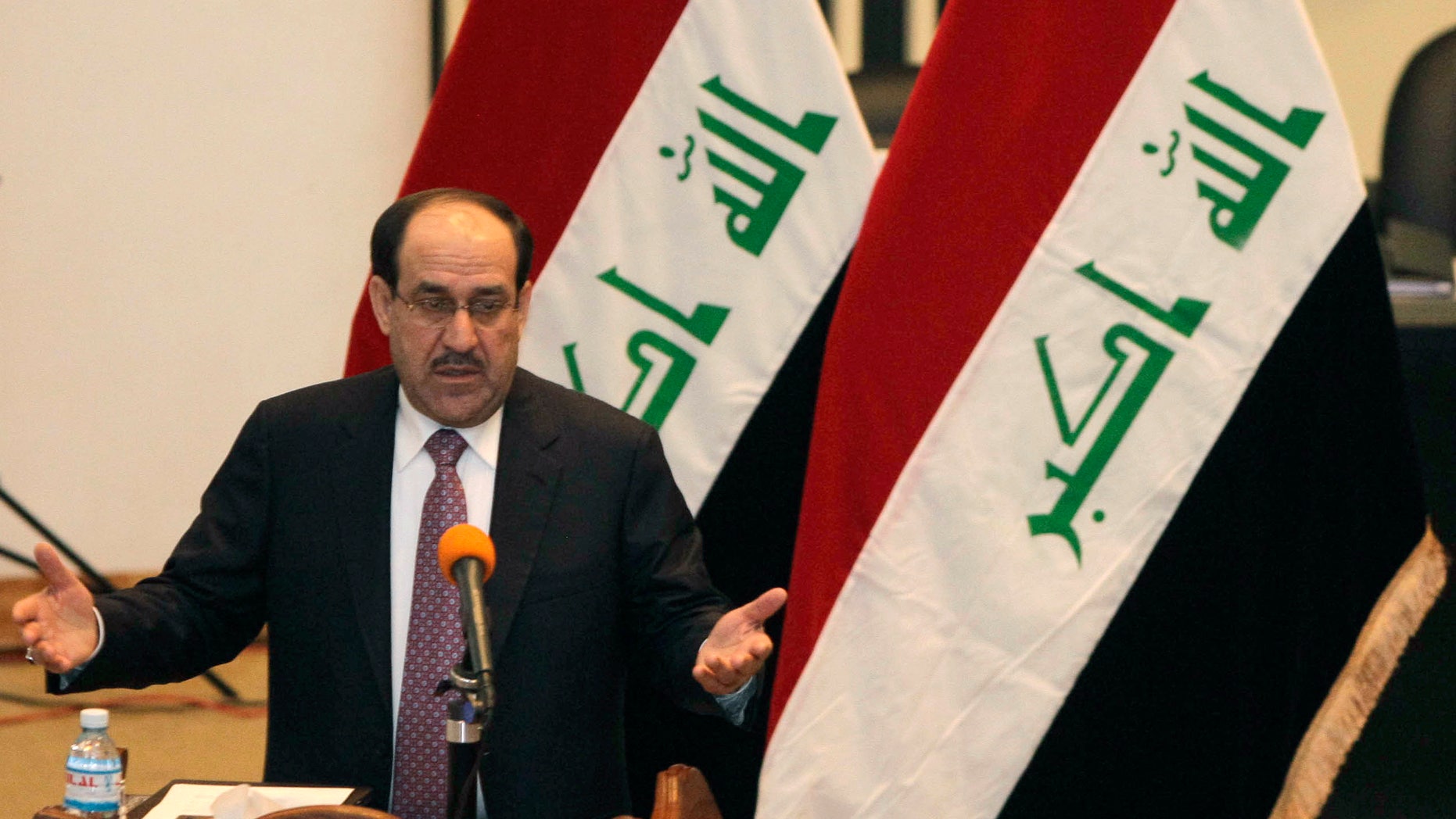Dec. 21: Iraq's Prime Minister Nouri al-Maliki speaks to the Iraqi lawmakers before submitting his new government for approval in Baghdad, Iraq.