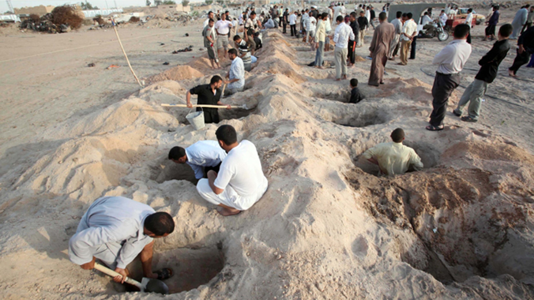 April 23, 2010: gravediggers set to work as victims of a wave of bombings arrive for burial in the Shiite holy city of Najaf, 100 miles south of Baghdad, Iraq.