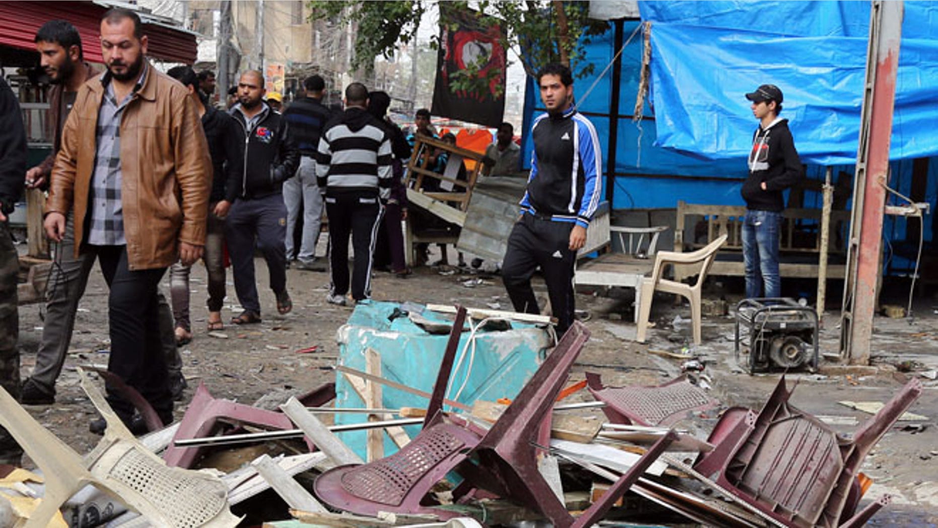 Nov. 21, 2013: Iraqis inspect the aftermath of a late-night bombing at a cafe in Bayaa neighborhood, southwestern Baghdad, Iraq.