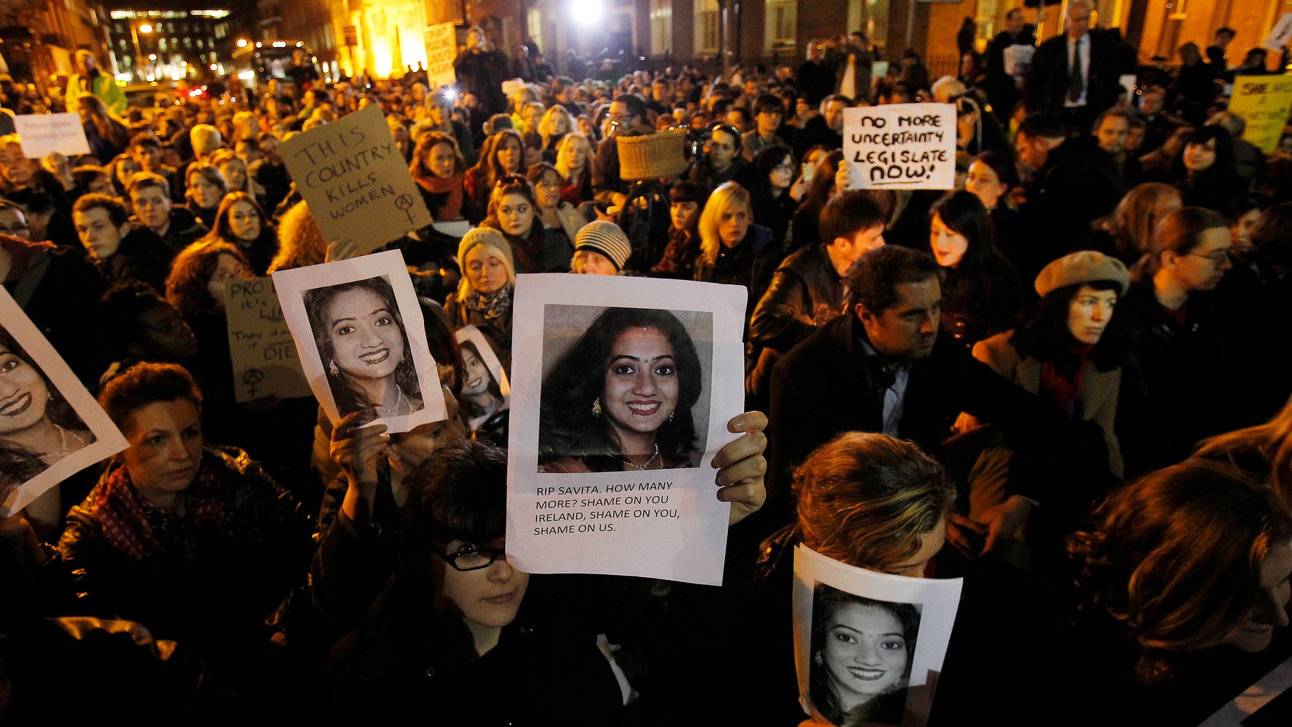 Nov. 14, 2012: Protestors outside Leinster House in Dublin against the death in October of Savita Halappanavar, pictured, a dentist aged 31, who was 17 weeks pregnant, after suffering a miscarriage and septicaemia.