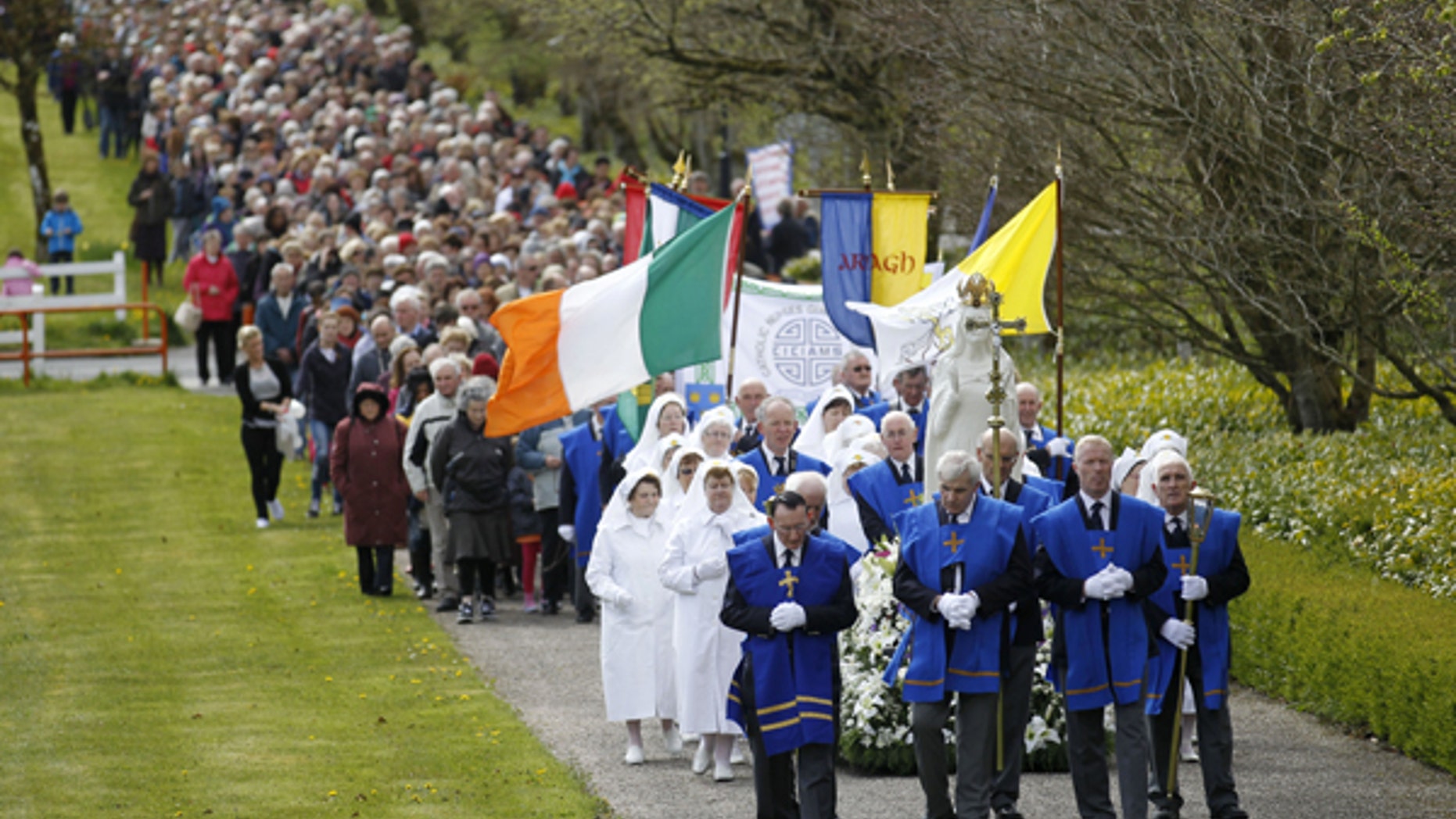 In this Saturday, May 4, 2013 file photo thousands of Roman Catholics take part in a Rosary Procession at Knock Shrine, Ireland. The group Chooselife held a National Prayer Vigil for the right to life of mothers and babies during a service at Knock Shrine.