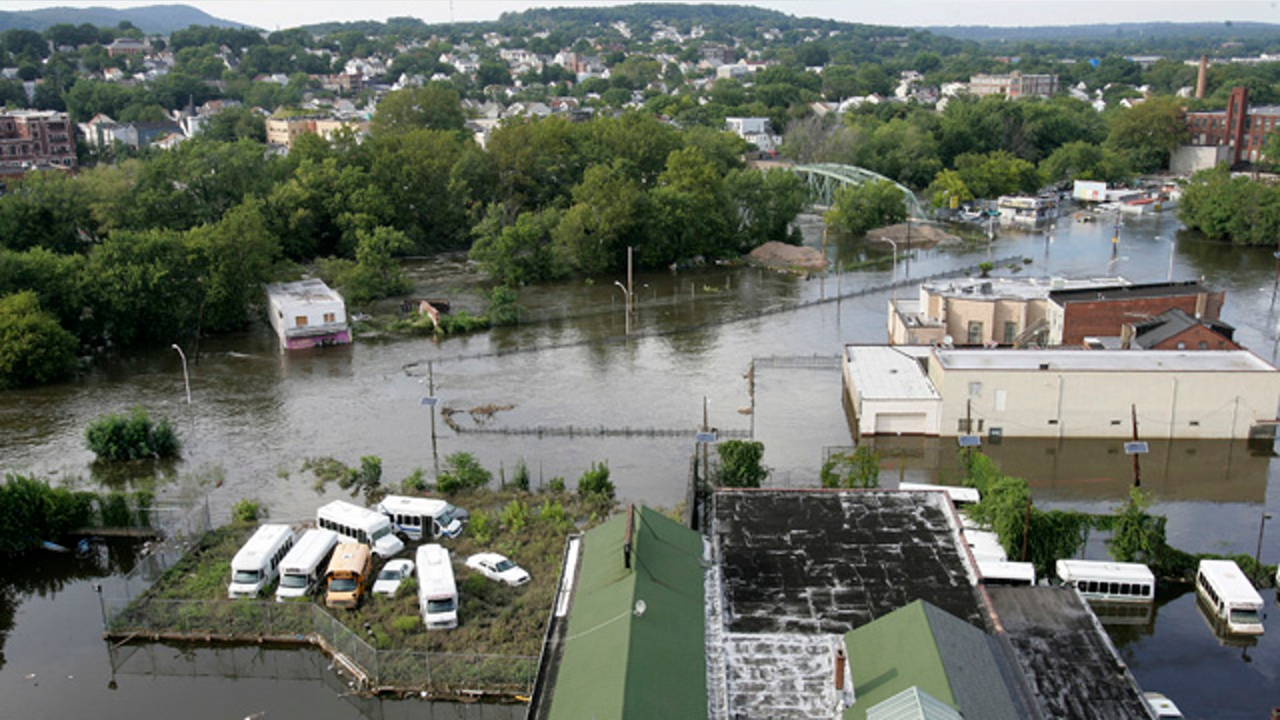 Aug. 31: The swollen Passaic River floods River Road in Paterson, N.J.