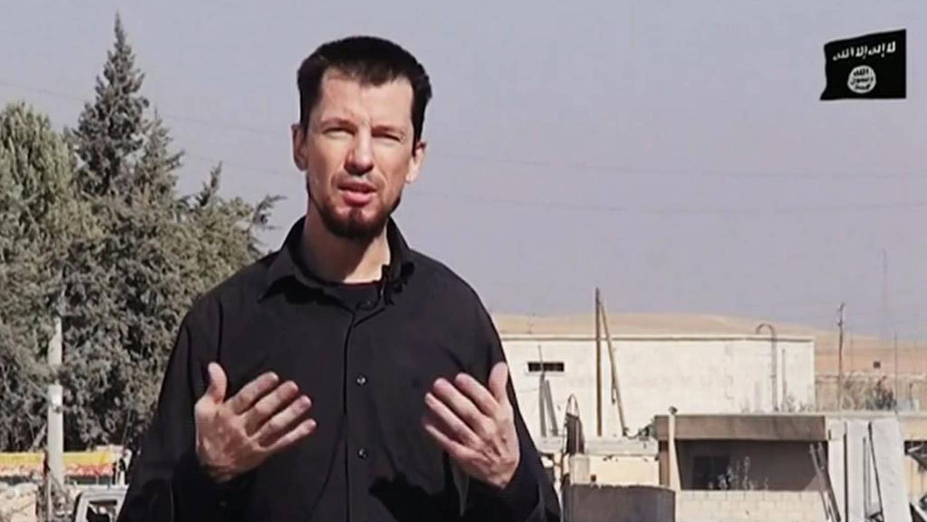 In this still image taken from an undated video published on the Internet by the Islamic State group militants, captive British journalist John Cantlie speaks into a camera in what he identifies as the embattled Syrian town of Kobani. In the video, Cantlie says Islamic State fighters have pushed deeper into the town despite airstrikes by a U.S.-led coalition. It's the latest propaganda video in which Cantlie is exploited by the extremists to take on the role of a war correspondent. AP cannot verify the location independently. (AP Photo)