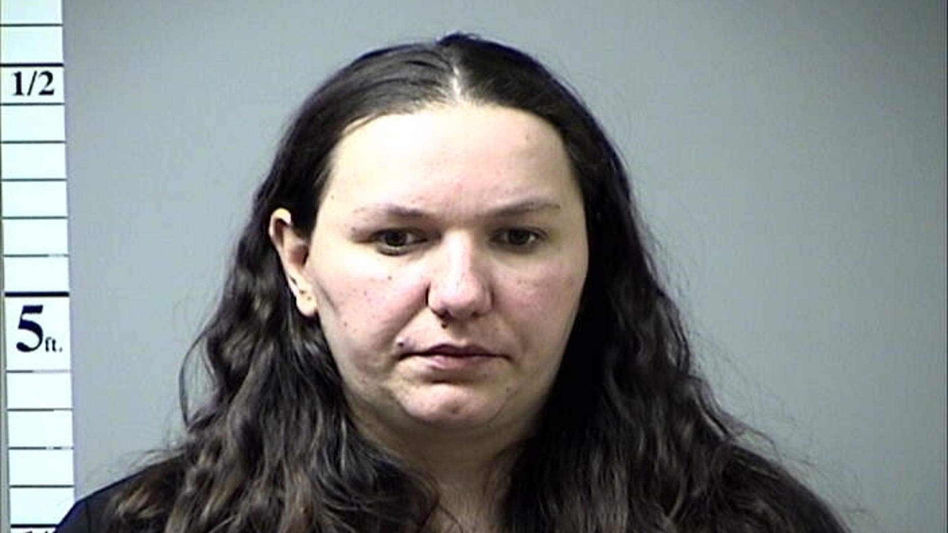 This undated photo provided by the St. Charles County Jail via St. Louis Post Dispatch, shows Sedina Hodzic. Hodzic, a Bosnian immigrant accused of funneling money and military supplies to terror groups in Iraq and Syria will remain in federal custody, after her lawyer told a judge Wednesday, Feb. 18, 2015, that he wants clarity on her immigration status before seeking bond. She is among six people named in a federal indictment earlier this month. Her husband, Ramiz Hodzic, and another man were also named, along with two people from Illinois and one from New York State. (AP Photo/St. Charles County Jail via St. Louis Post Dispatch)