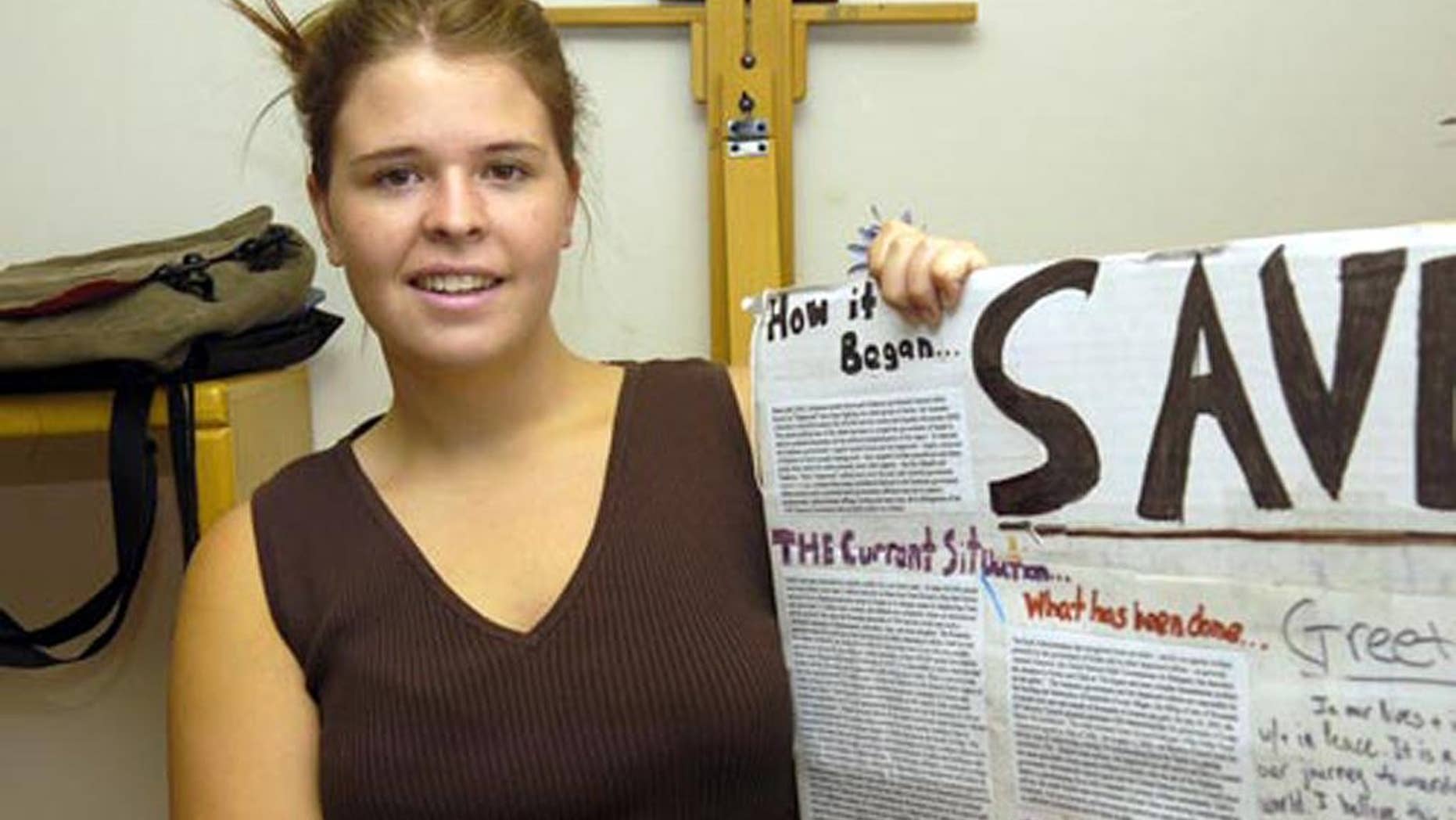 In this May 30, 2013, photo, Kayla Mueller is shown after speaking to a group in Prescott, Ariz. The parents of the late American hostage Kayla Mueller say they were told by American officials that their daughter was repeatedly forced to have sex with Abu Bakr Baghdadi, the leader of the Islamic State group. (AP Photo/The Daily Courier, Jo. L. Keener ) MANDATORY CREDIT