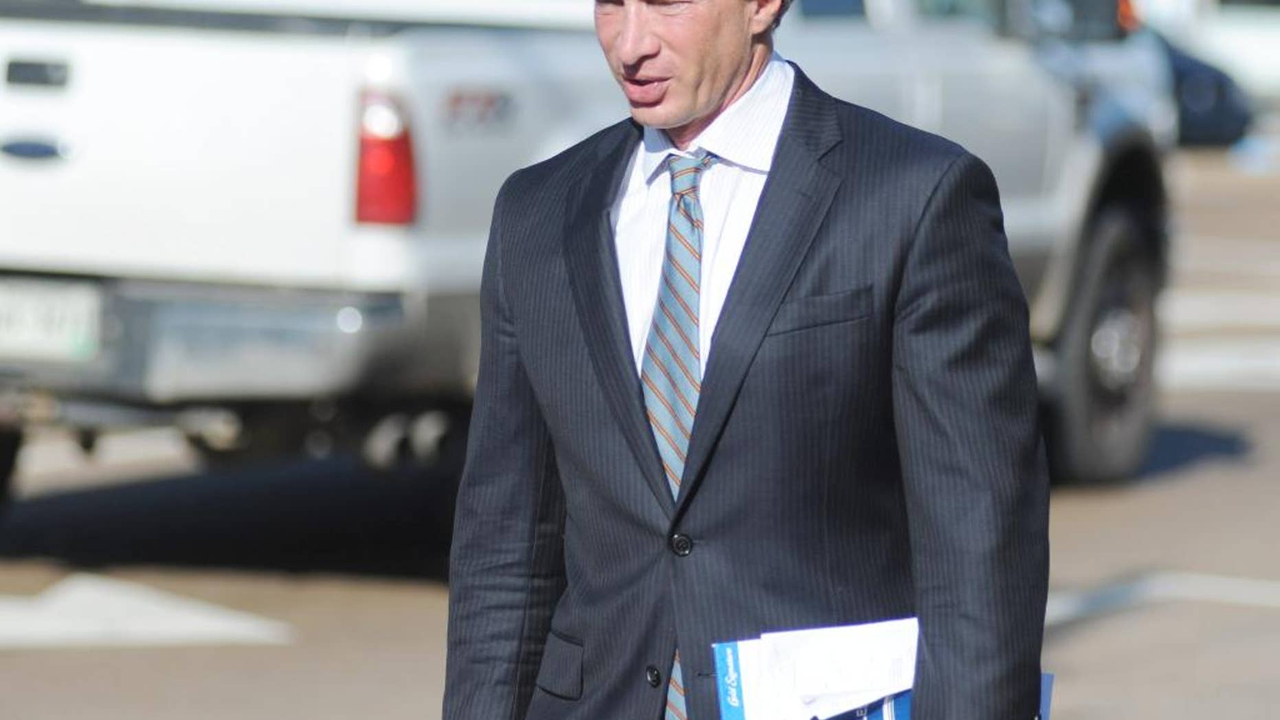 Attorney Ken Coghlan, representing Jaelyn Delshaun Young, enters federal court for a hearing in Oxford, Miss. on Tuesday, Aug. 11, 2015. Young, and Muhammad Oda Dakhlalla, were arrested over the weekend on charges that they were trying to travel abroad to join the Islamic State militant group. (Bruce Newman/Oxford Eagle via AP)