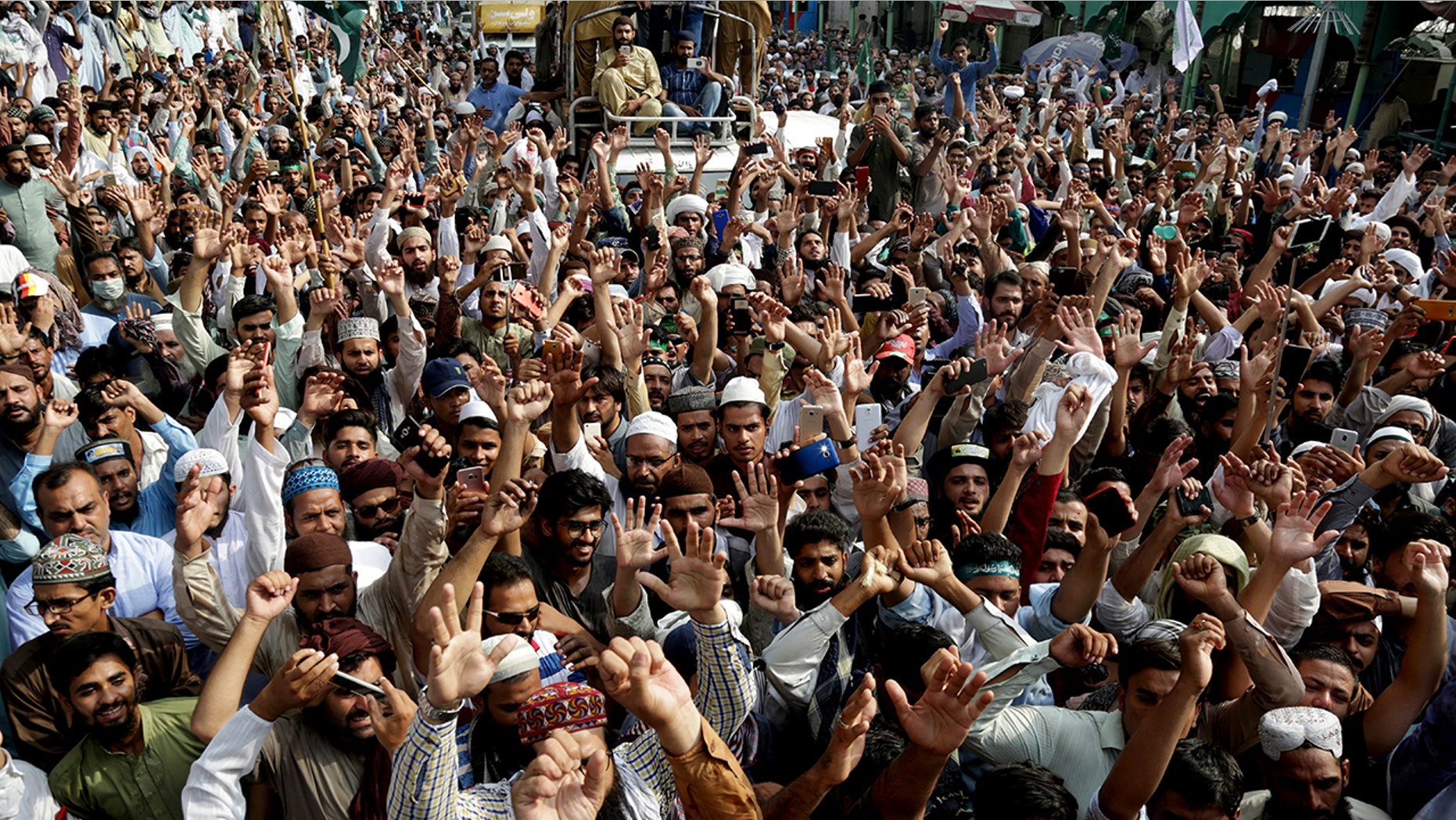 Supporters of Pakistani religious group shout slogans during a march towards Islamabad Wednesday in Lahore, Pakistan. Thousands of Islamists in Pakistan launched a march toward the capital to protest a far-right Dutch lawmaker’s plans to hold a Prophet Muhammad cartoon contest later this year. Physical depictions of the prophet are forbidden in Islam, and deeply offensive to Muslims.