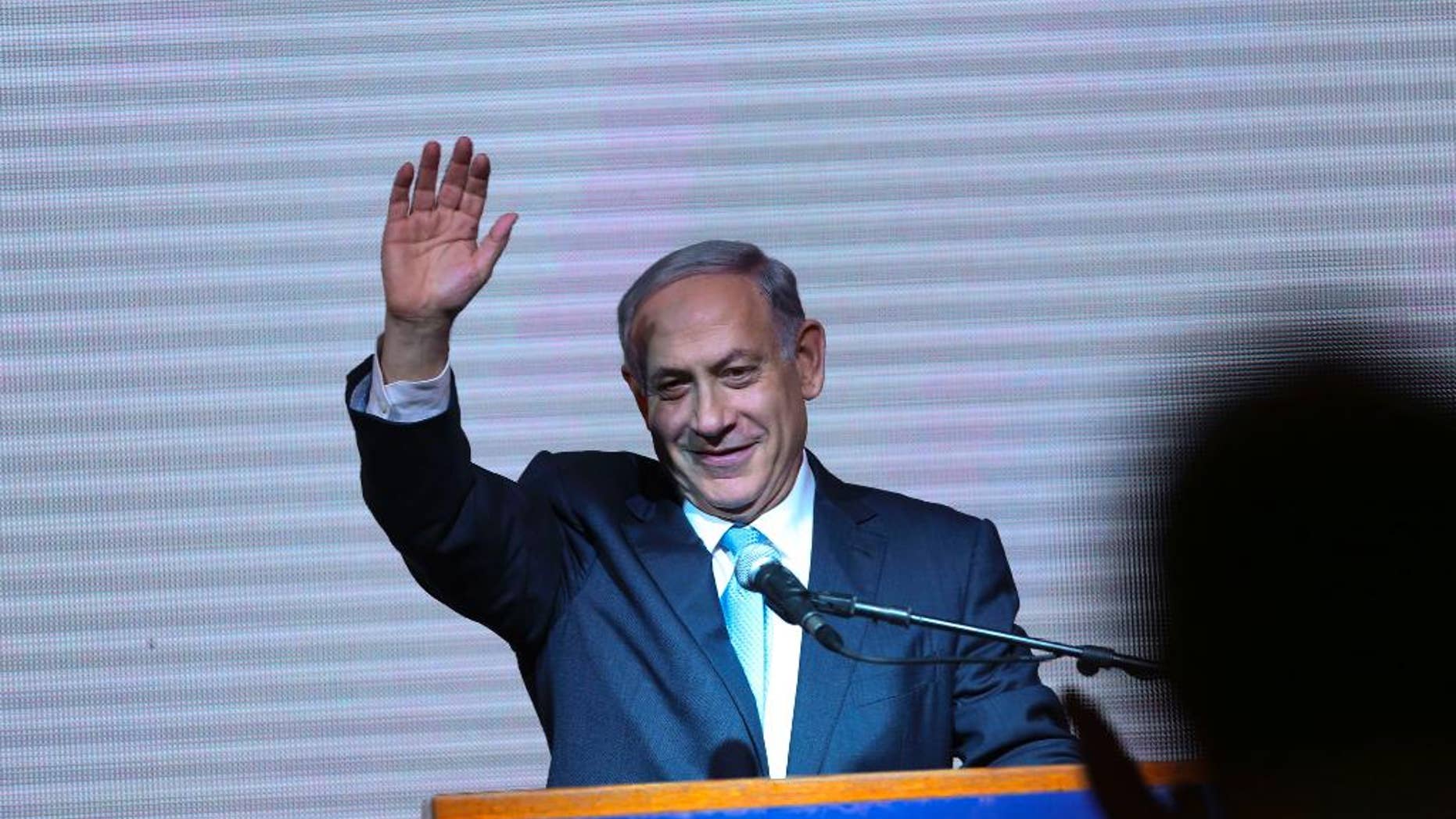 FILE - In this Wednesday, March 18, 2015 file photo, Israeli Prime Minister Benjamin Netanyahu greets supporters at the party's election headquarters In Tel Aviv. Before the elections, Israel had already become a source of division, rather than unity, for American Jews, who bitterly debated the ever-expanding Jewish settlements in Palestinian territories and the acceptable boundaries of dissent from Israeli policies. The outcome of the Israeli election will only deepen that polarization, experts say. Netanyahu's anti-Arab campaign rhetoric and his rejection of a Palestinian state, they say, will further splinter American Jews into hard left and right camps, and intensify conflicts over what it means to be loyal to the Jewish state. (AP Photo/Oded Balilty)