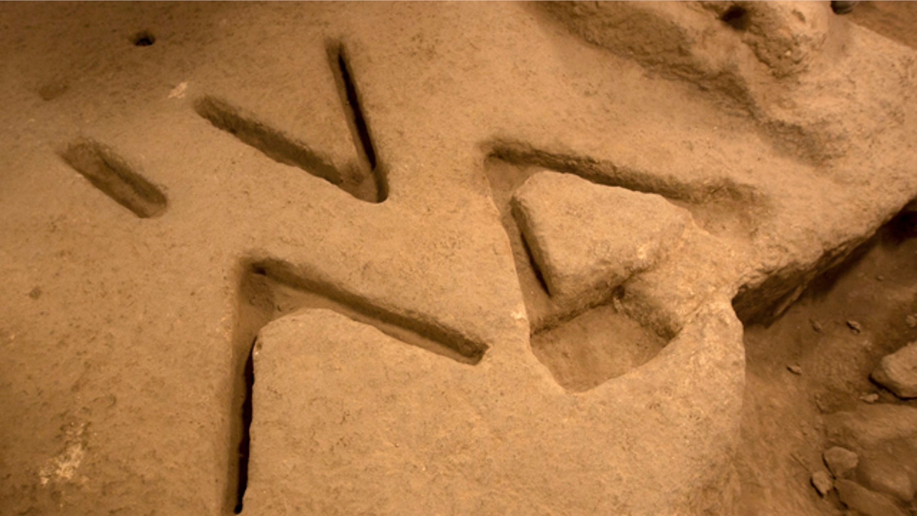 Dec. 1, 2011: Marks carved in the bedrock over 2,800 years ago, seen in an archeological excavation in the city of David near Jerusalem's Old City, have archaeologists stumped.