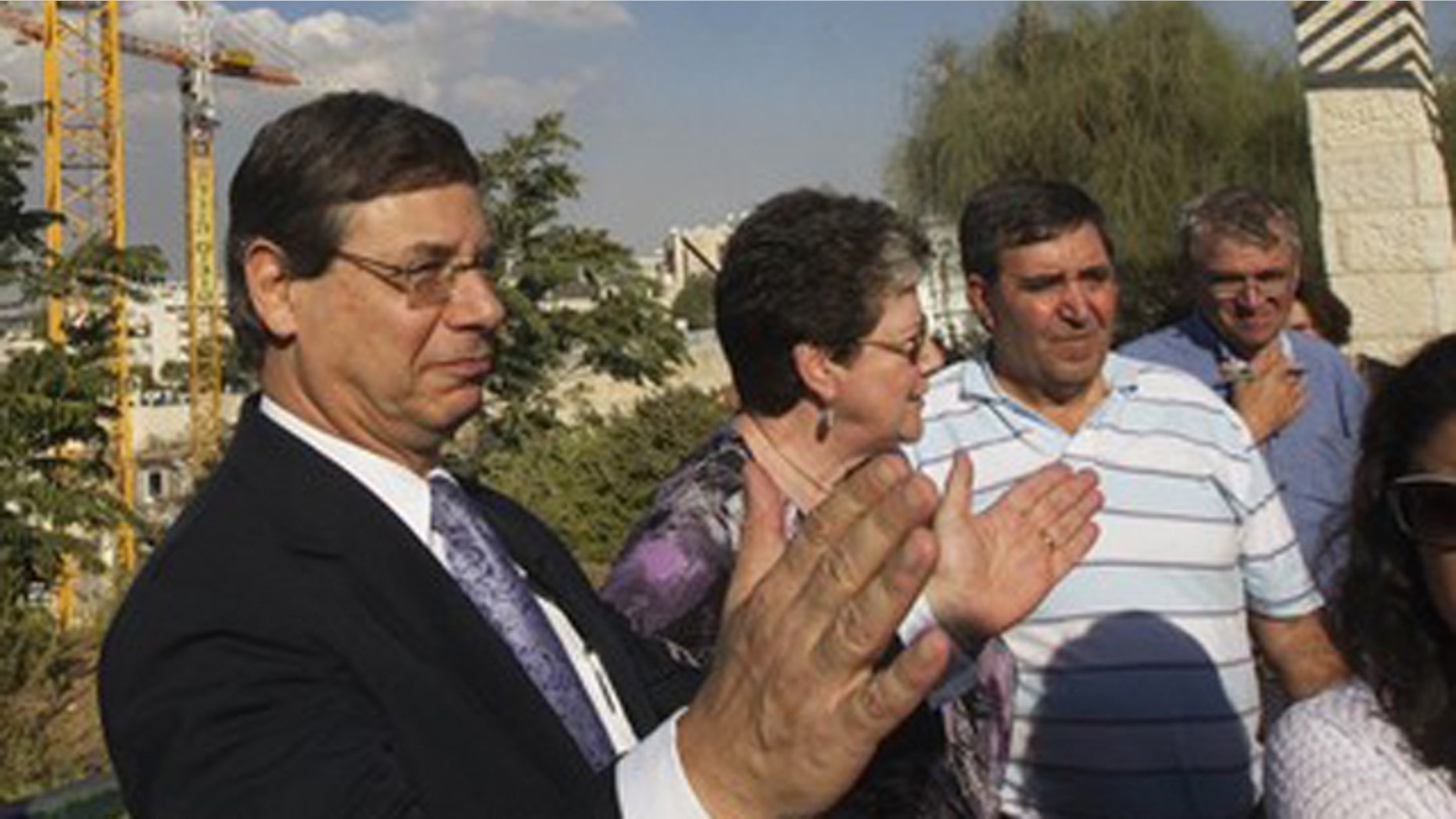 FILE: Israel's Deputy Foreign Minister Danny Ayalon (C) gestures as he speaks to the media during a tour of Gilo, a Jewish settlement on land Israel captured in 1967 and annexed to its Jerusalem municipality.
