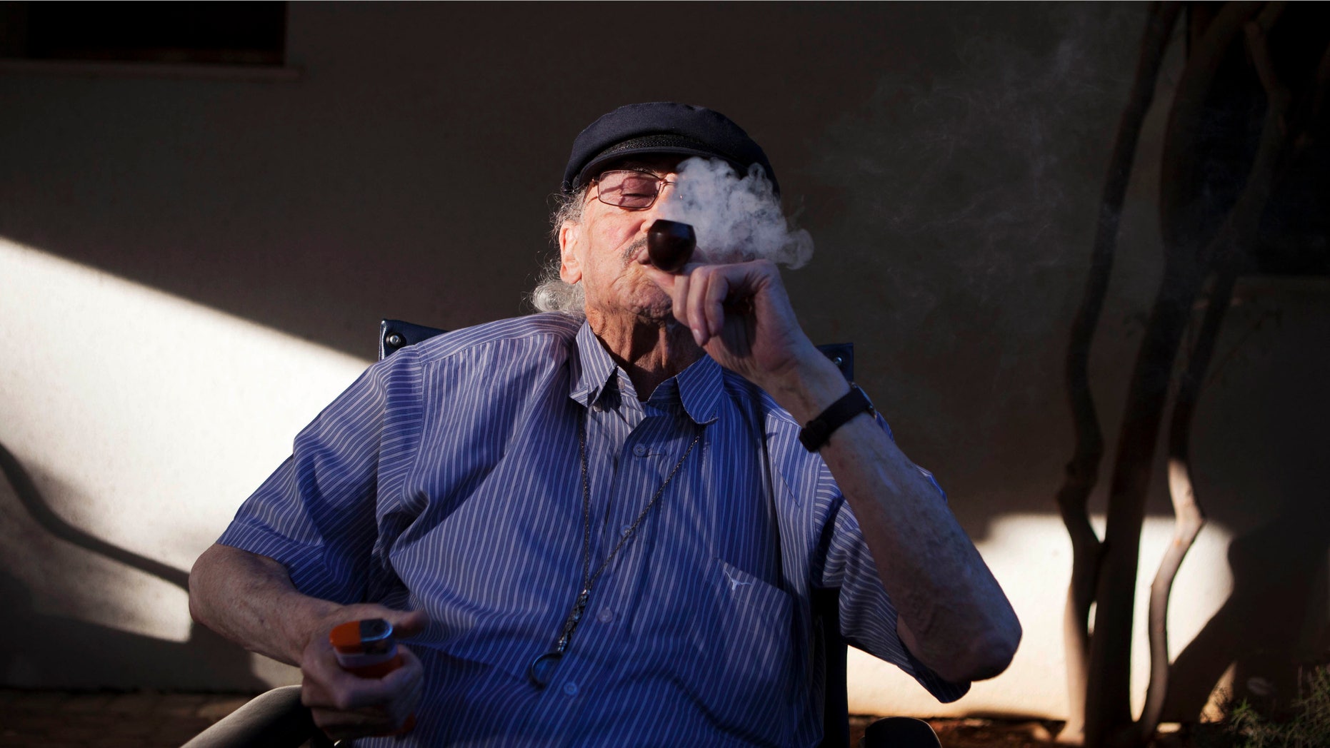 Oct. 30, 2012: Moshe Rute, 80, smokes medical cannabis at the old age nursery home in kibbutz Naan next to the city of Rehovot, Israel. Marijuana is illegal in Israel but medical use has been permitted since the early nineties for cancer patients and those with pain-related illnesses such as Parkinson's, Multiple Sclerosis, and even post-traumatic stress disorder.