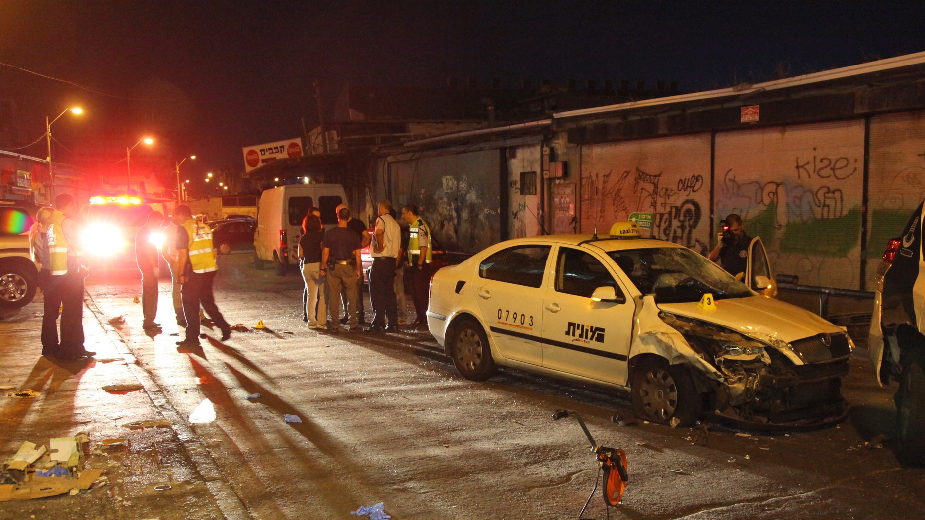 August 29: Israeli policemen gather at a site where a Palestinian man crashed a car into a crowd of people and stabbed a few others near a nightclub in Tel Aviv. Israeli police say few Israelis have been wounded in a Palestinian militant attack near a Tel Aviv nightclub. The attacker, a 19-year-old from the West Bank city of Nablus, was arrested.