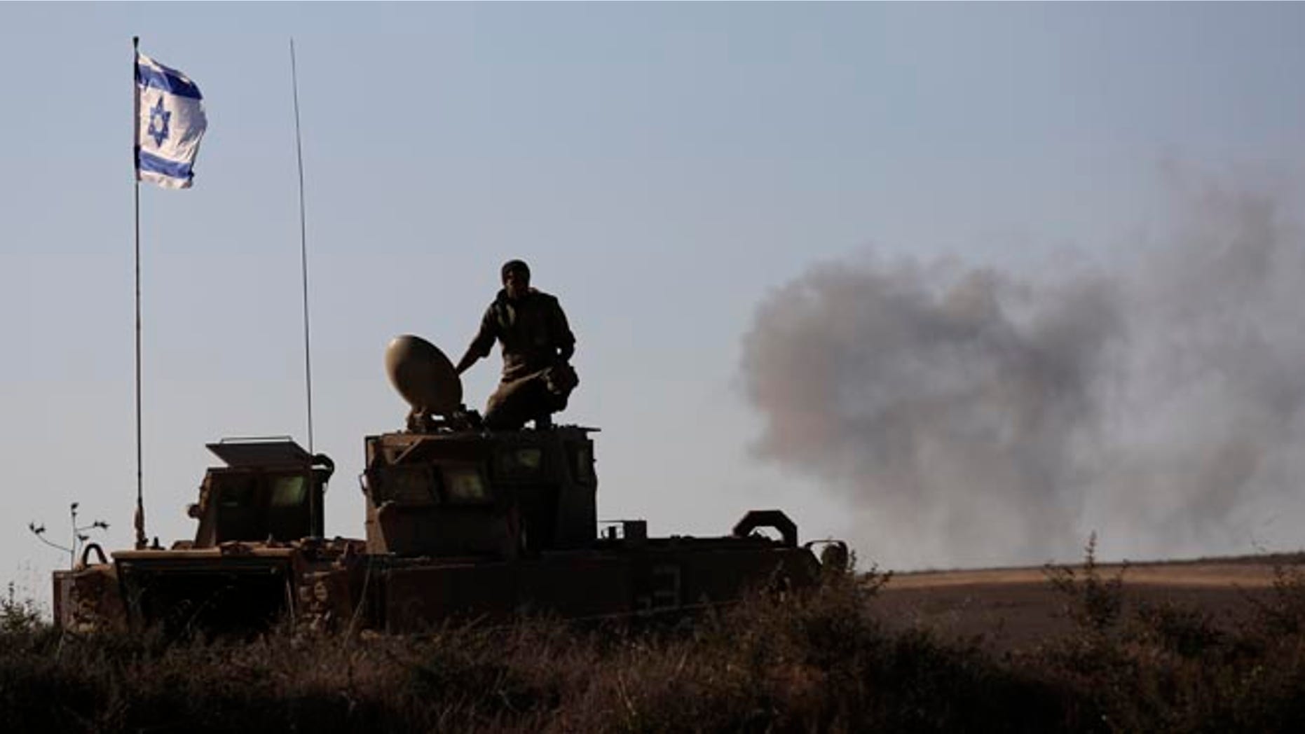 Aug. 3, 2014: An Israeli solder near the Israeli-Gaza border, where a man was injured from a mortar shell fired from the Gaza Strip.
