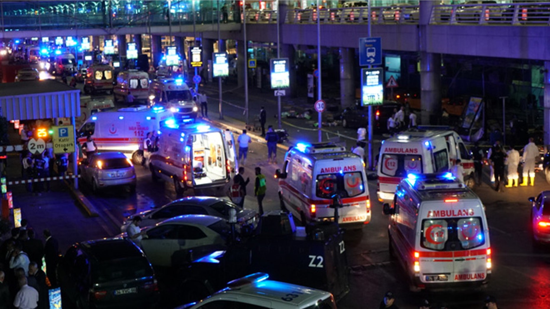 ISTANBUL, TURKEY - JUNE 28: Security and ambulances block the road outside Turkey's largest airport, Istanbul Ataturk, after it was hit by a suicide bomb attack on June 28, 2016, Turkey. Two suicide bombers opened fire before blowing themselves up at the entrance to the main international airport in Istanbul, killing at least 10 people and wounding at least 60 people according to Justice Minister Bekir Bozdagç. (Photo by Mehmet Ali Poyraz/Getty Images)