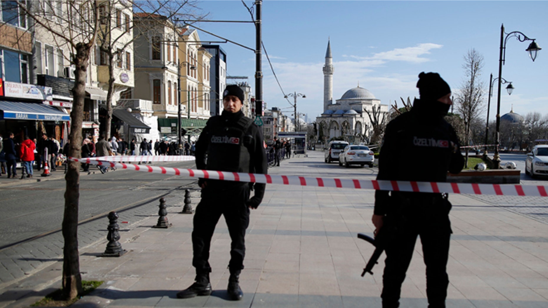 Policemen secure the historic Sultanahmet district after an explosion in Istanbul, Tuesday, Jan. 12, 2016. An explosion killed at least 10 people and wounded 15 others Tuesday morning in a historic district of Istanbul popular with tourists. Turkish President Recep Tayyip Erdogan said a Syria-linked suicide bomber is believed to be behind the attack. (AP Photo/Emrah Gurel)