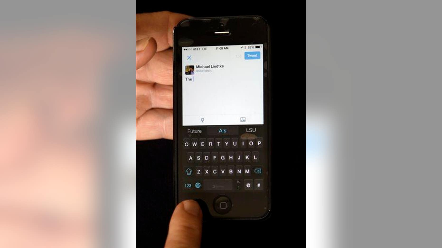 A reporter demonstrates the SwiftKey keyboard on an iPhone.