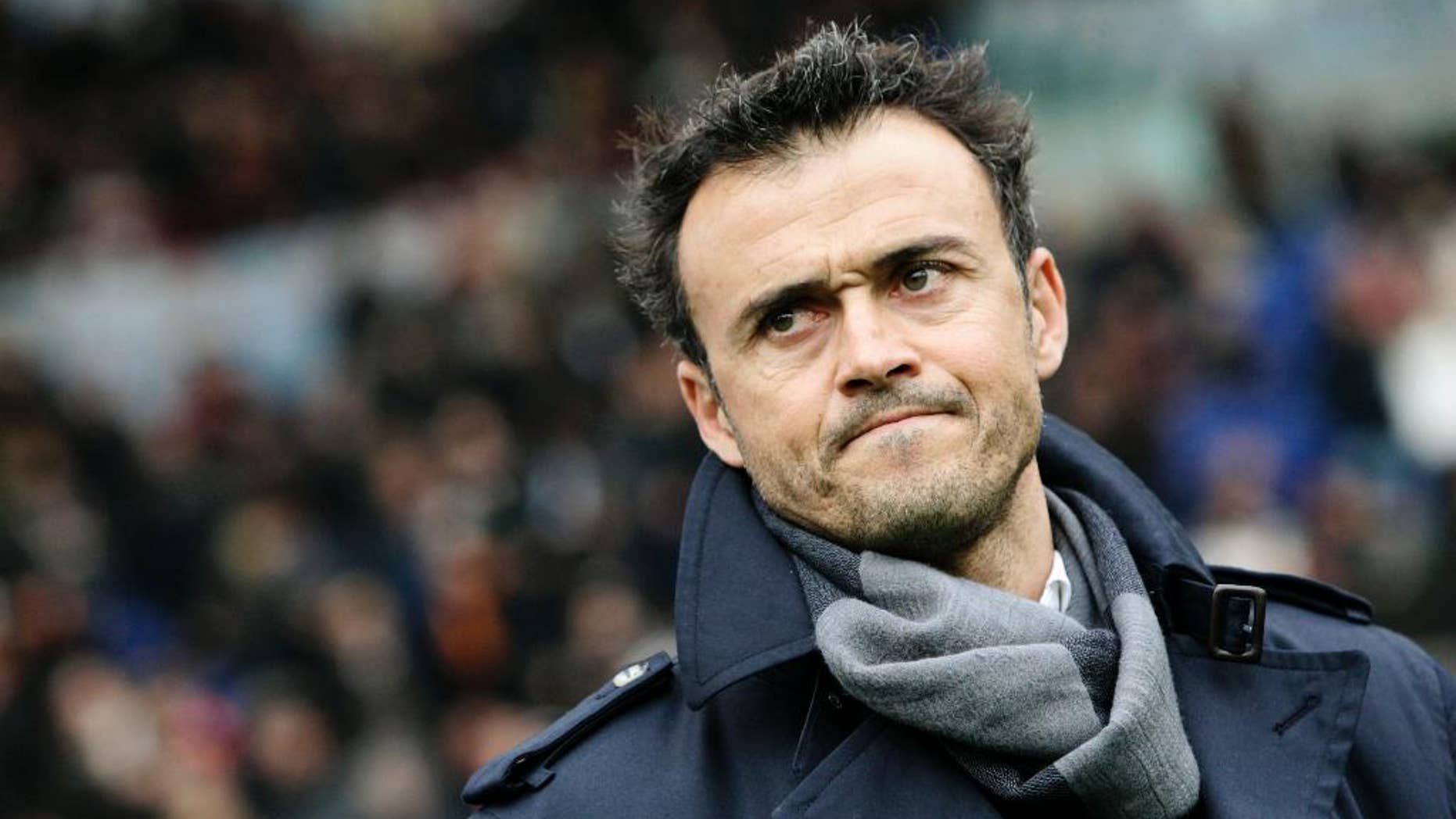 FILE - In this Sunday, Feb. 19, 2012, file photo, AS Roma coach Luis Enrique, of Spain, waits for the start of a Series A soccer match between AS Roma and Parma, at Rome's Olympic stadium. Barcelona has hired Luis Enrique as its new coach, succeeding Gerardo Martino who stepped down on Saturday after the club failed to defend its Spanish league title. Barcelona said on its website Monday, May 19, 2014, that Enrique has agreed to a two-year deal. (AP Photo/Riccardo De Luca, File)