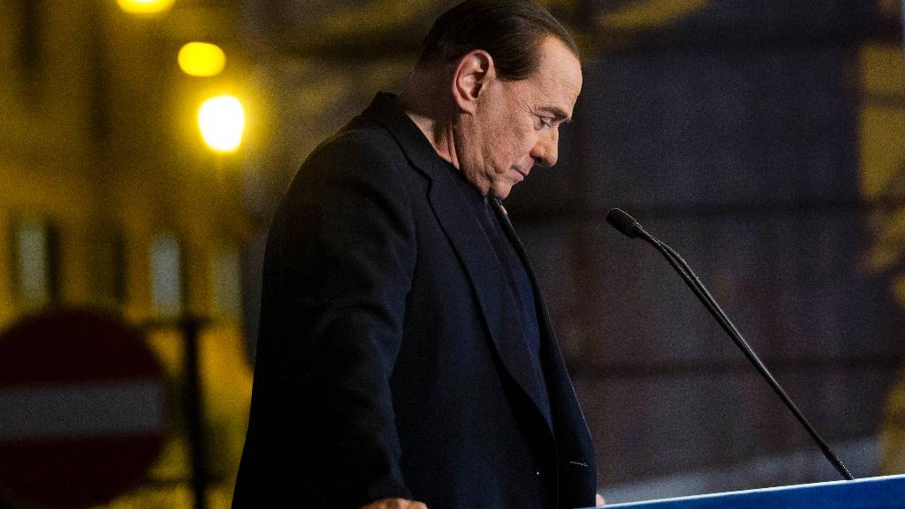 In this Wednesday, Nov. 27, 2013 file photo Silvio Berlusconi pauses during a rally in Rome. Italy's highest court has upheld a two-year political ban against Silvio Berlusconi stemming from his tax fraud conviction. The Court of Cassation ruling handed down late Tuesday, March 19, 2014 is the latest setback for Berlusconi, who was kicked out of Parliament last year after the high court upheld his conviction and four-year prison sentence. Despite the ban on holding or running for public office, Berlusconi remains a force in Italian politics, heading his Forza Italia party. (AP Photo/Alessandra Tarantino, File)