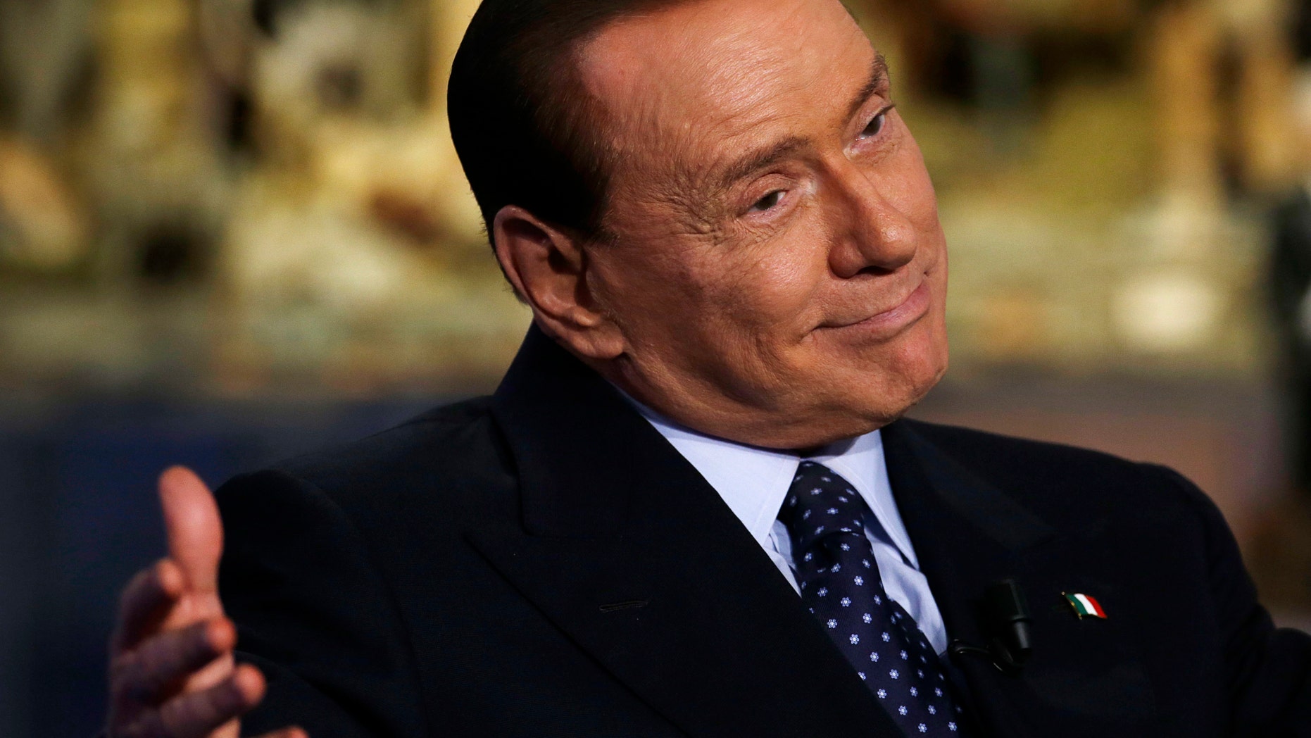 Dec. 18, 2012: Former Italian Premier and People of Freedom party Leader Silvio Berlusconi gestures while attending the recording of RAI (Italian State Television) TV talk show "Porta a Porta"(Door to Door) hosted by journalist Bruno Vespa, in Rome.